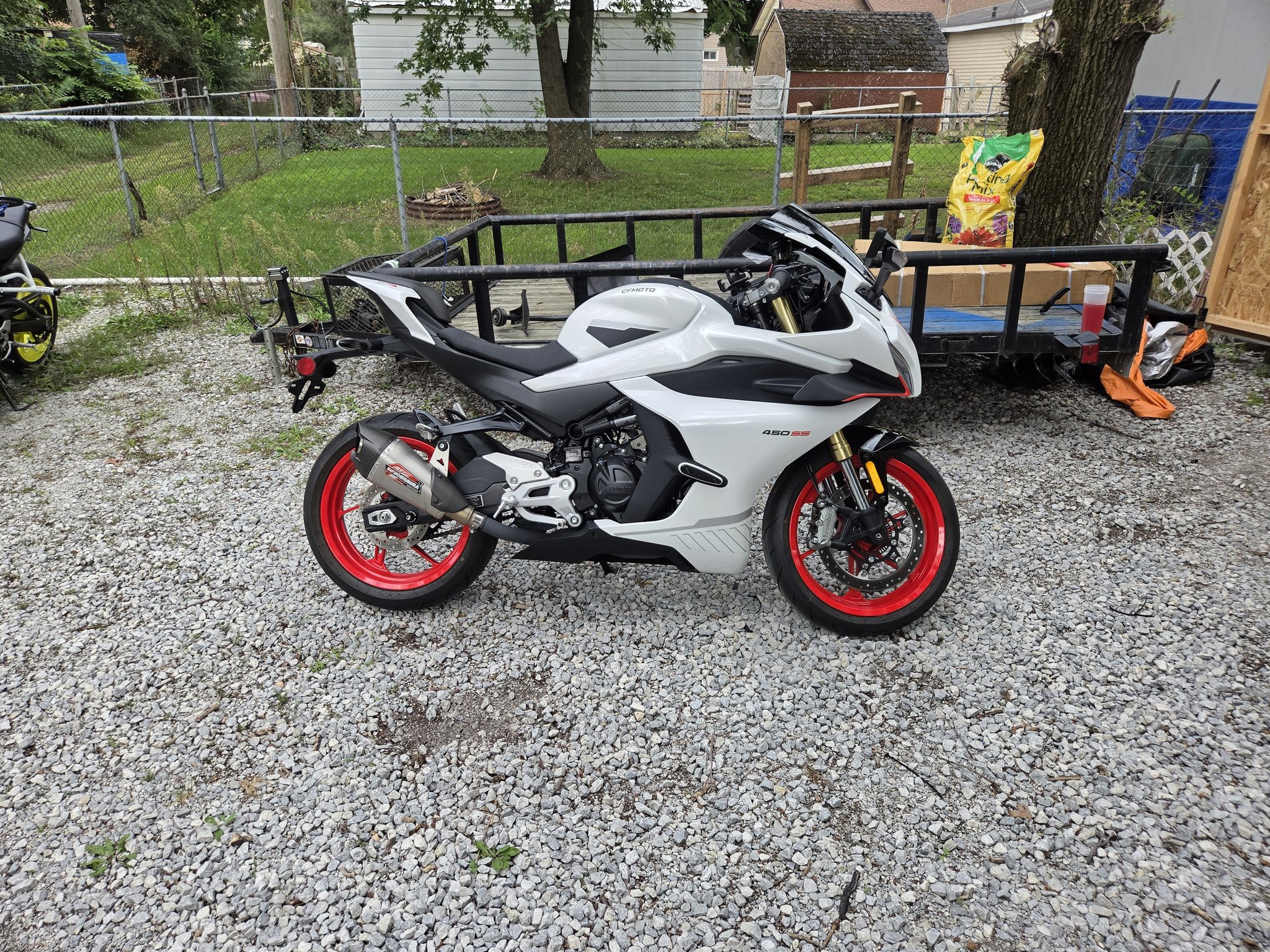 How to access the lower triple tree on CFMoto forks to lower the