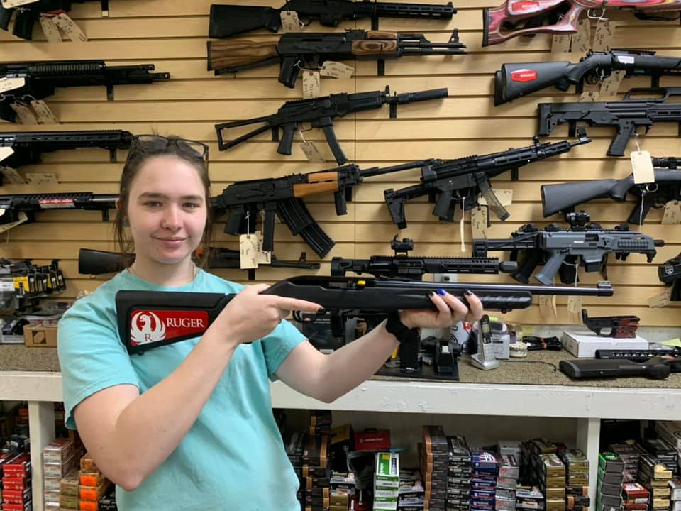 First Shot LLC. - Ms. Sierra is showing off a Ruger 10/22...