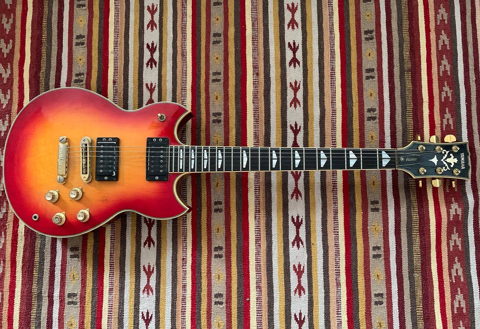Yamaha SG 2000 guitars in red and brown sunburst