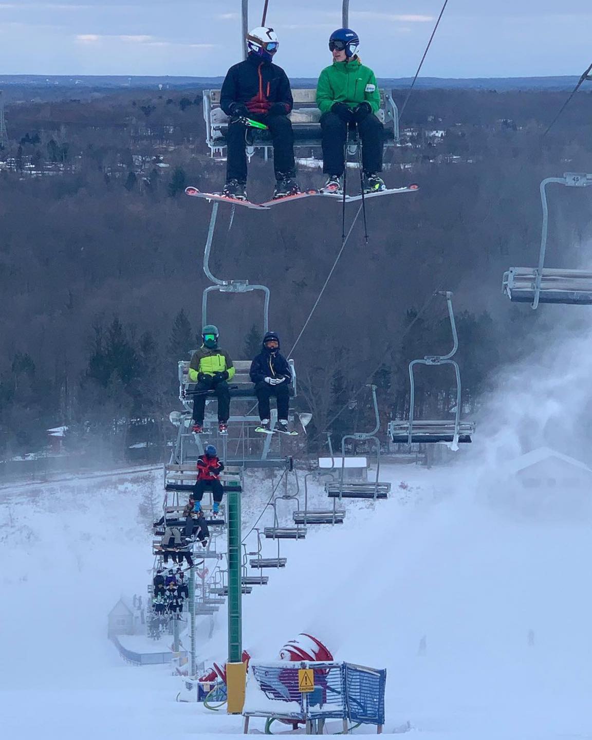 Pine - Ski racers ride the chairlift on a recent wintry day at # ...