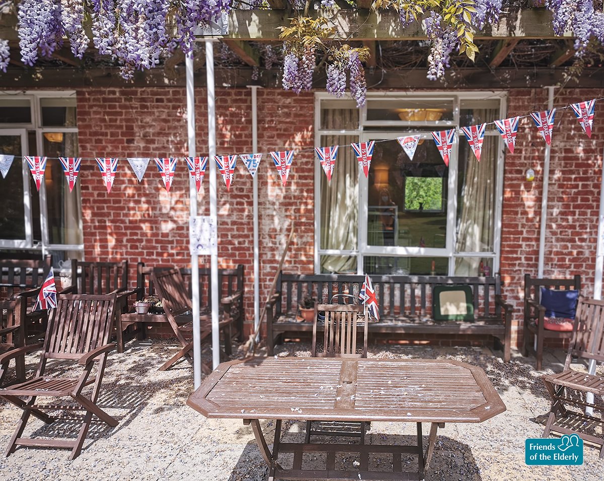 VE Day bunting and cake at The... - Friends of the Elderly