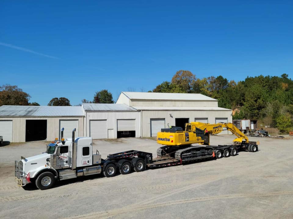 Isaac loaded a KOMATSU PC 290 log... - S&T Trucking, Inc.