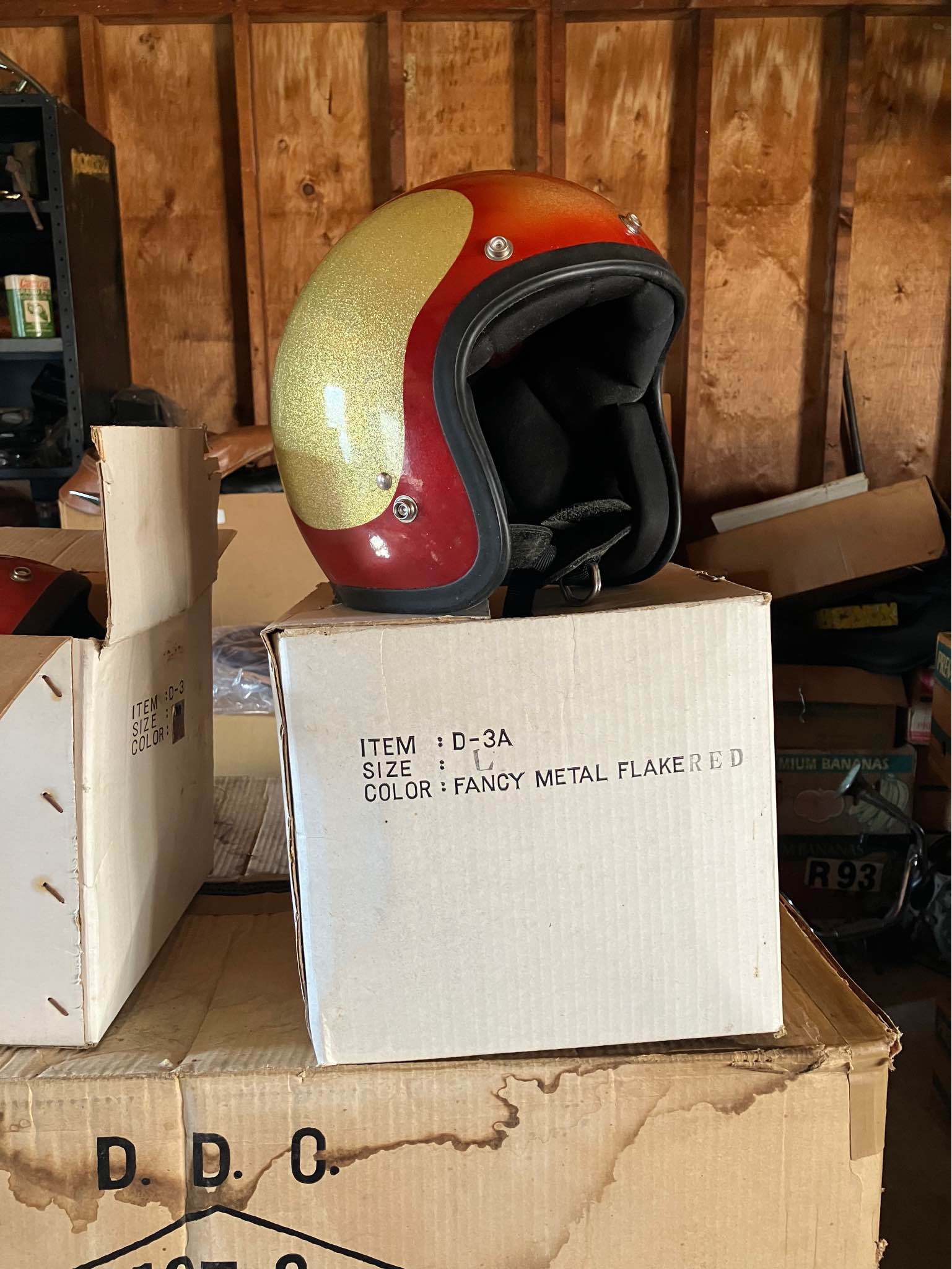 Box of 12 Shoei helmets, brand new from 1970s.