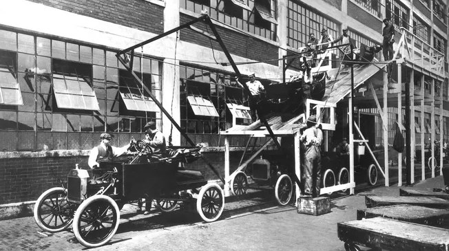 Model T Assembly Line Workers Henry Ford Sits On The Assembly Line In