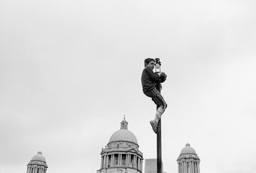 In - (7)A child up a lampost at the Pier Head during protests calling ...