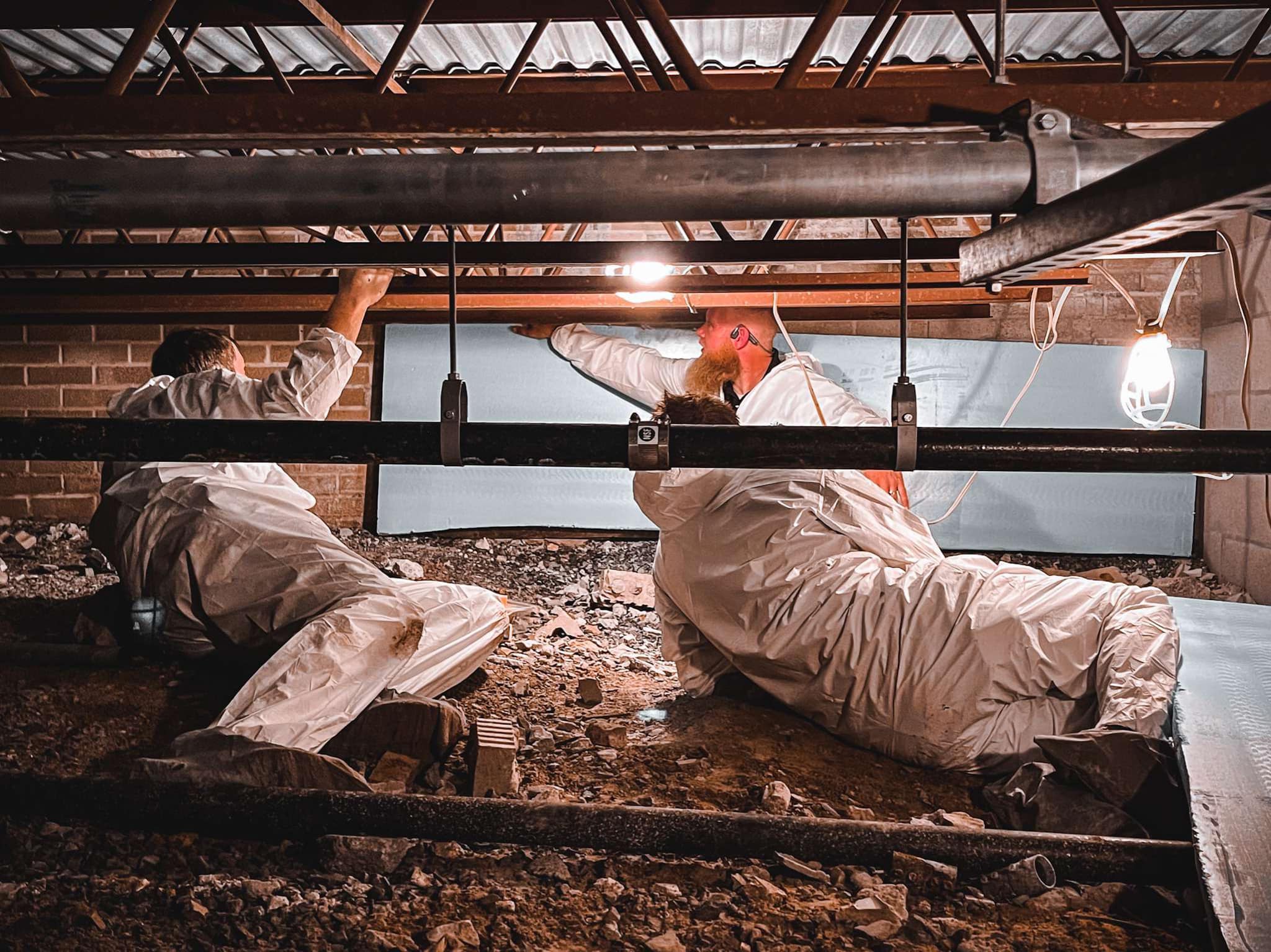 Apex - Pictured below is our VP of Mitigation training two technicians on a crawl space ...
