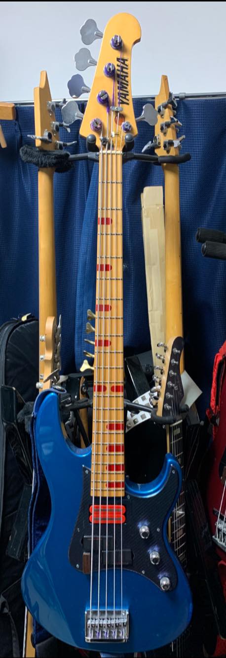 Yamaha Attitude basses customized with Monkey Grip and swirl paint