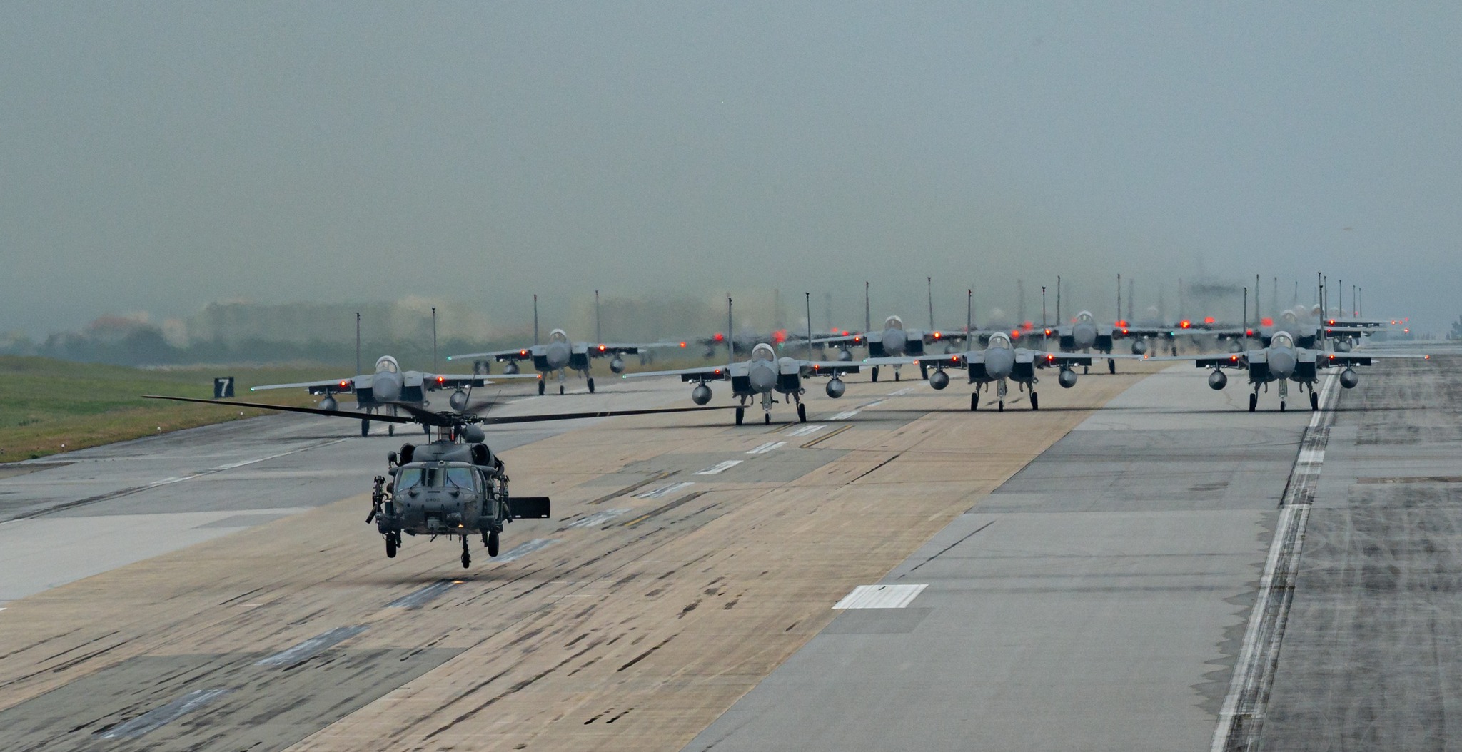 Ready to fly! ✈️ U.S. military aircraft line up on the runway