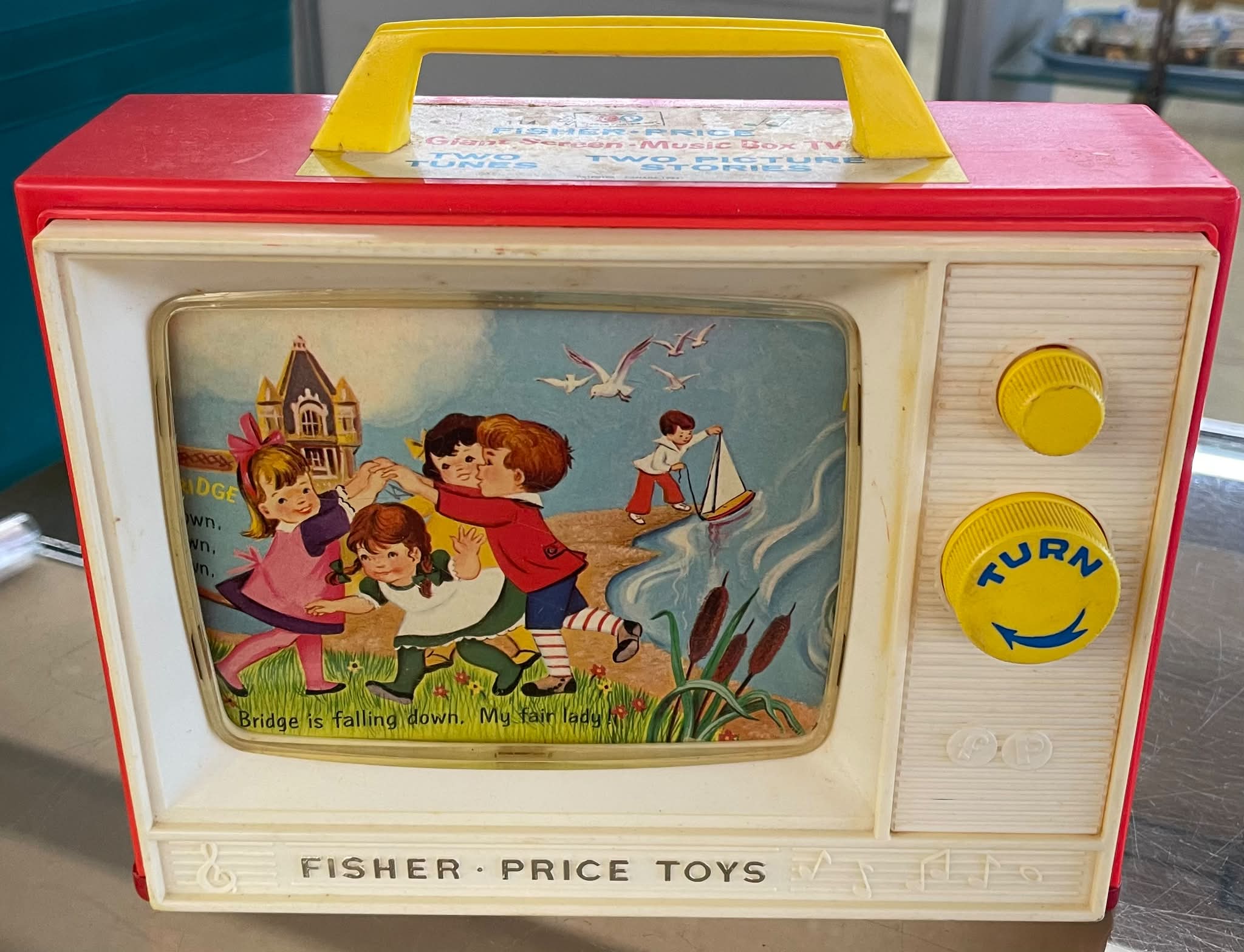 Fisher Price music box TV from the 60s. Complete wth Peek-a-boo screen