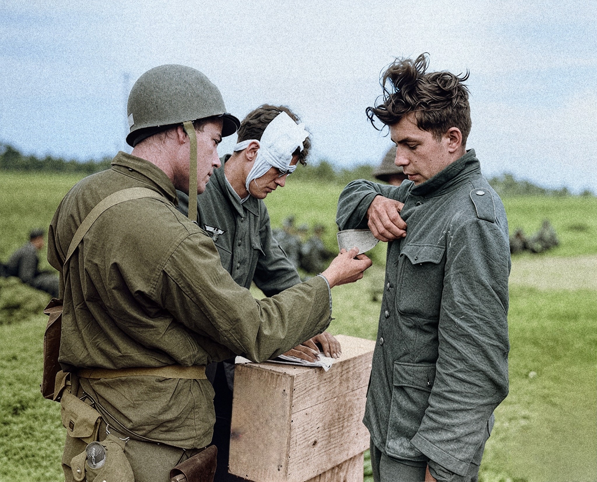 CH Inam - A US Soldier reads the identity tag of a young German POW as ...