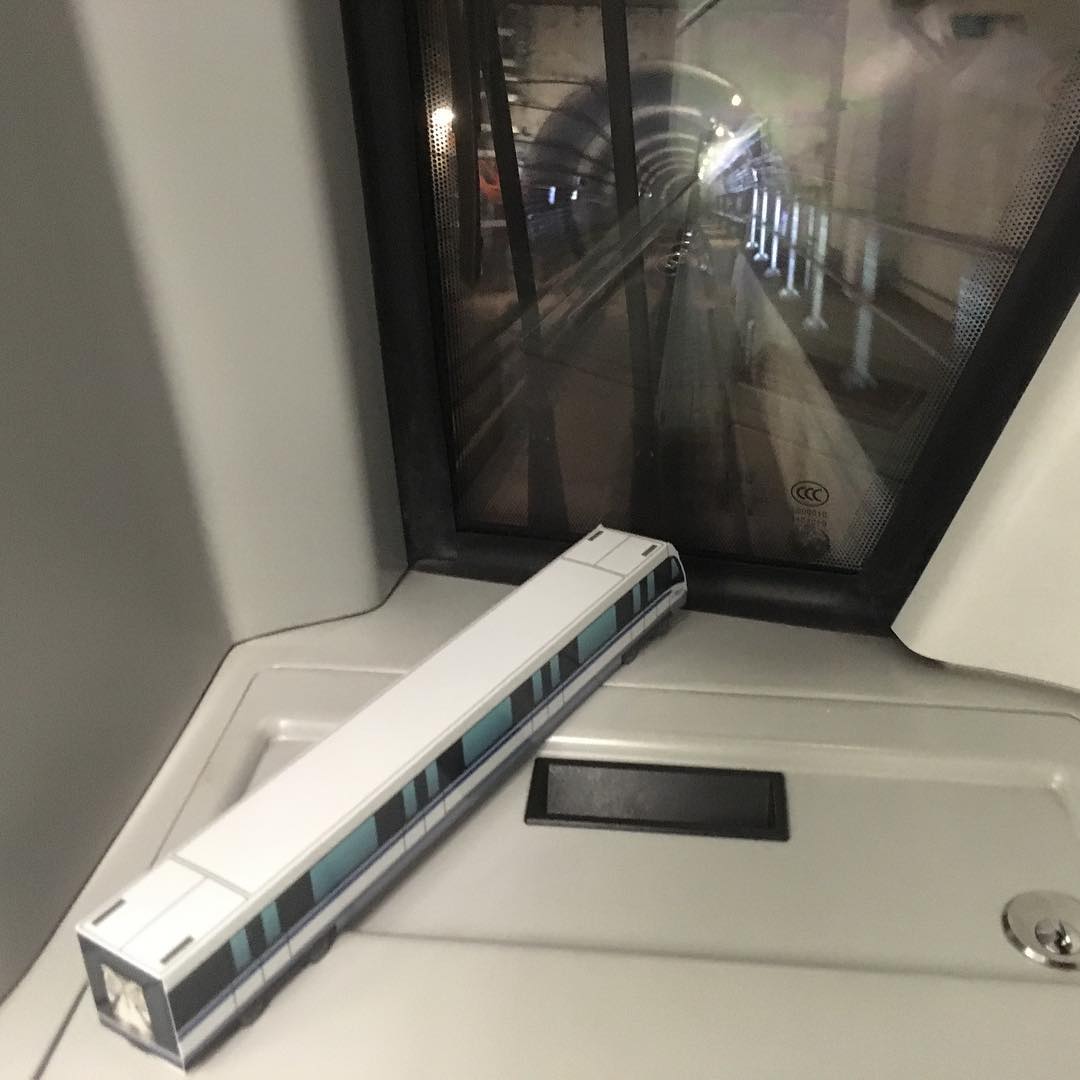 MRT - Our Downtown Line paper model train is watching its actual train ...