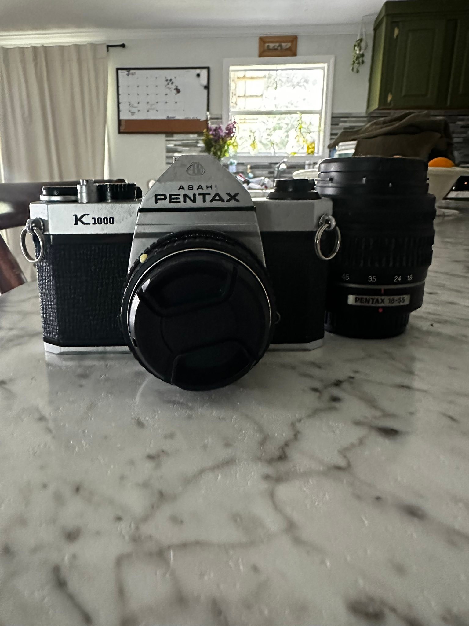 It's a pentax k100d 6.1mp digital slr camera with an 18-55mm, I
