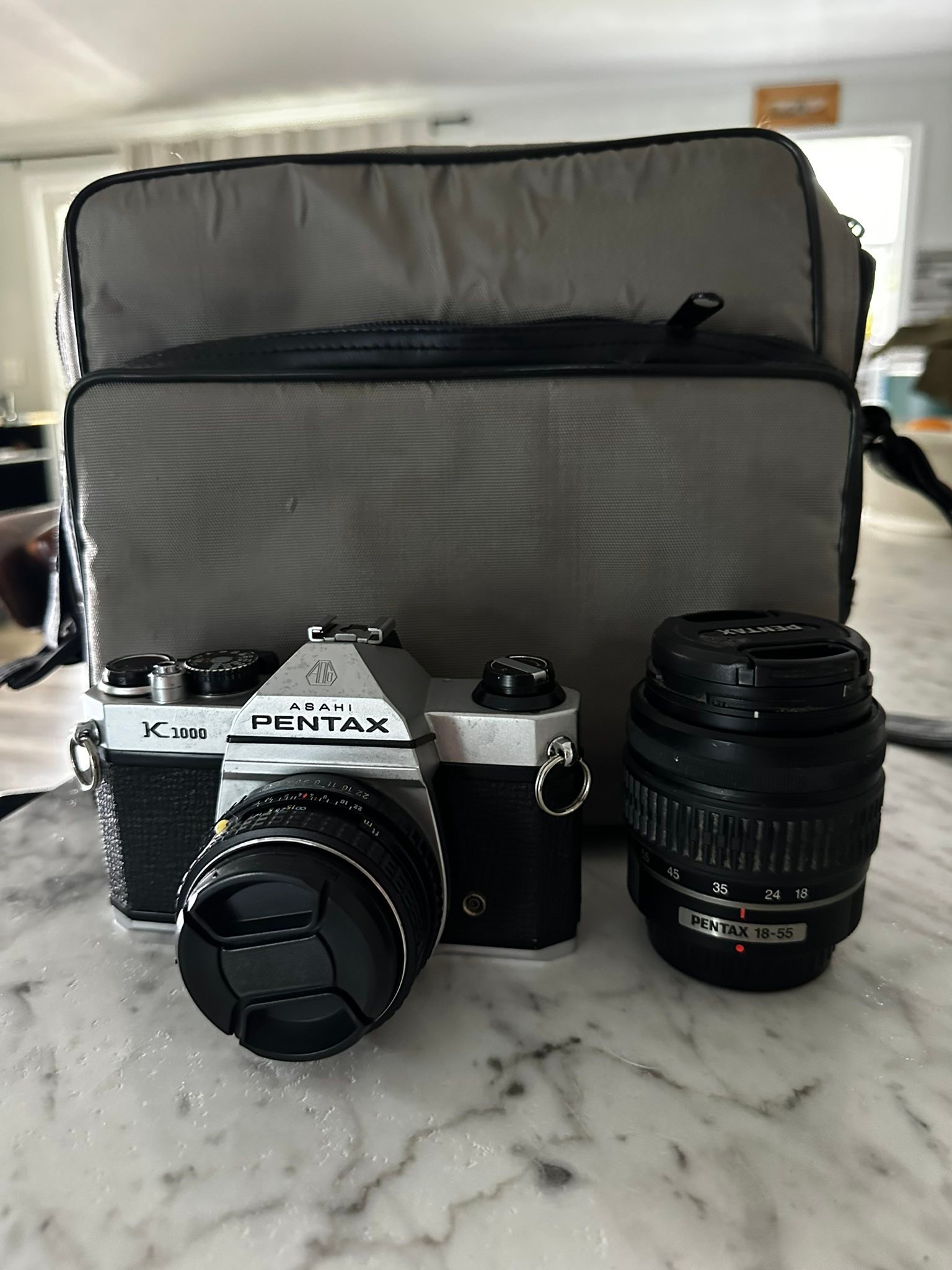 It's a pentax k100d 6.1mp digital slr camera with an 18-55mm, I