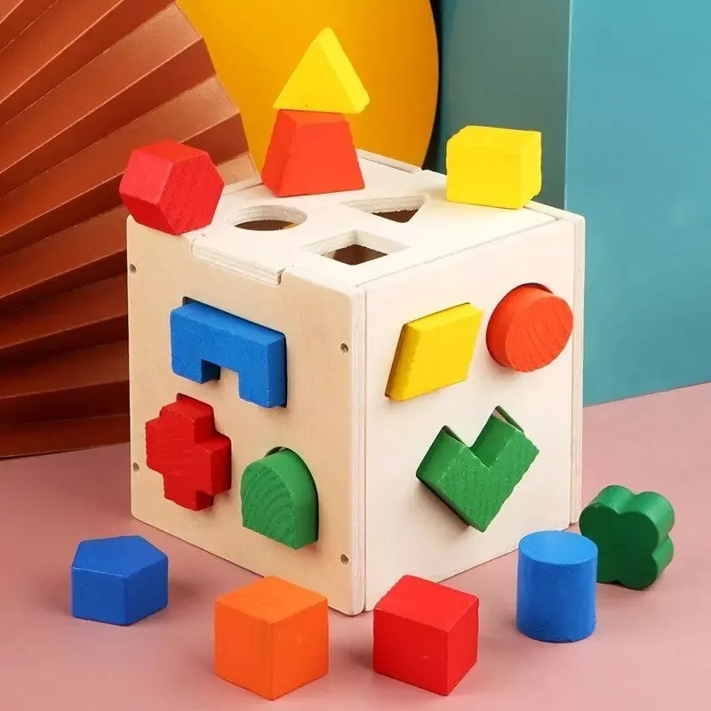 Exploringhub.pk - Shape Sorting Cube 15 Hole Wooden... | Facebook