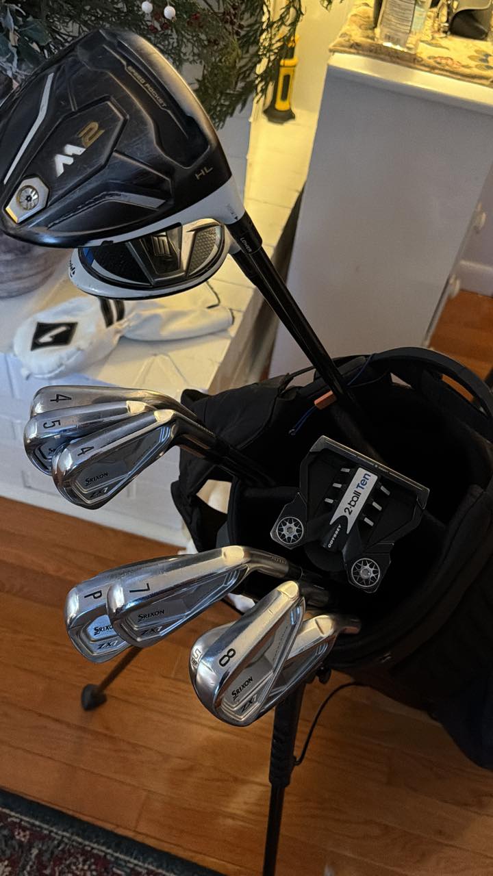 Golfer's club setup with M2 sim driver and Titleist wedges