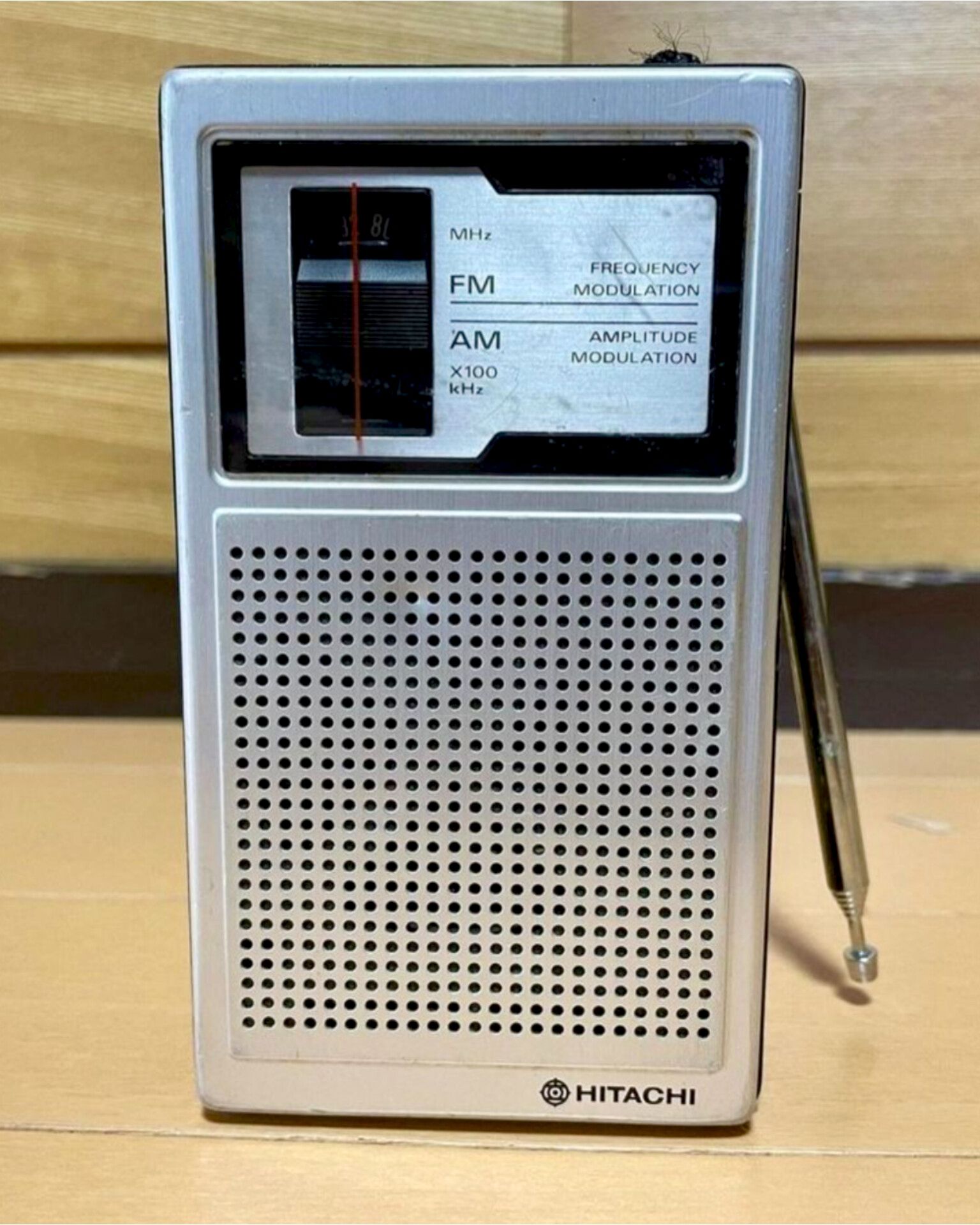portable Hitachi KH-1100 AM/FM transistor radio.