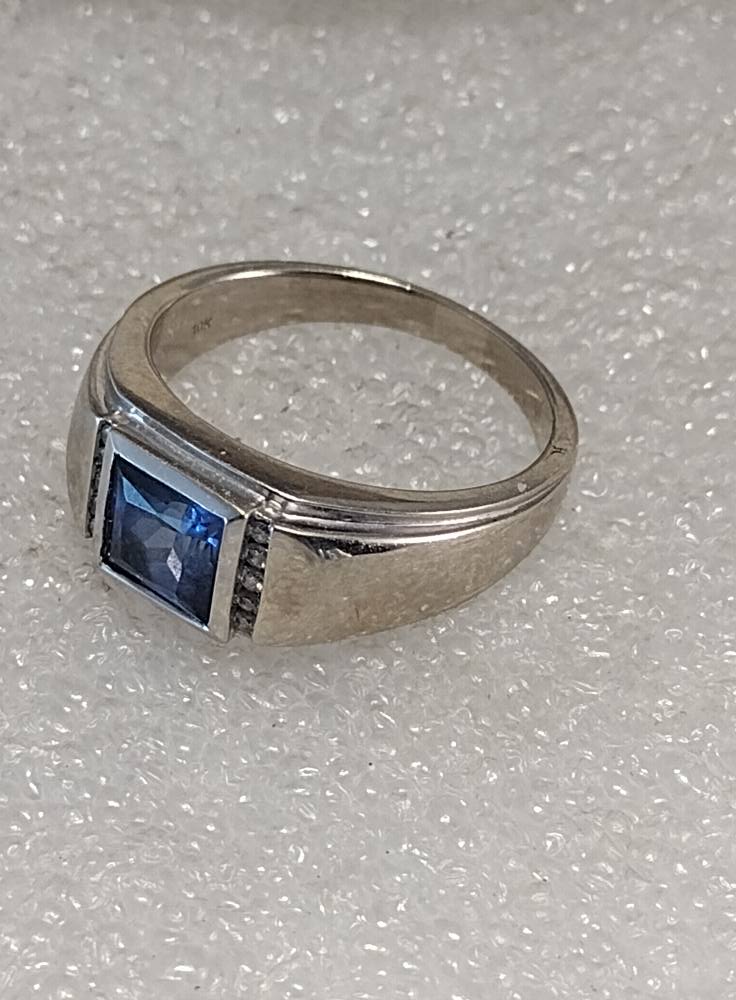 What are the blue stones in these vintage rings?
