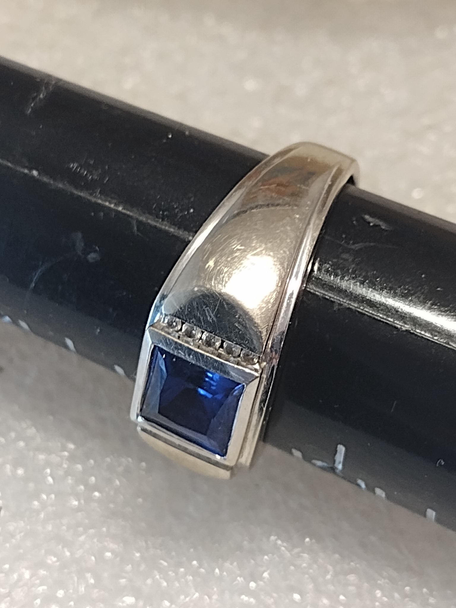 What are the blue stones in these vintage rings?