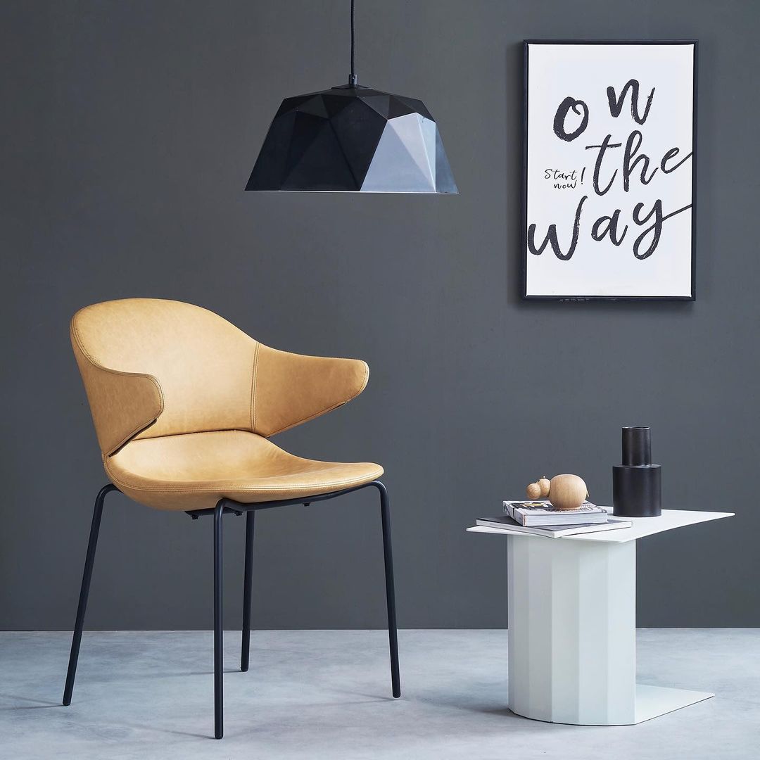 Commune - The iconic suspended armrest design of Hug chair...