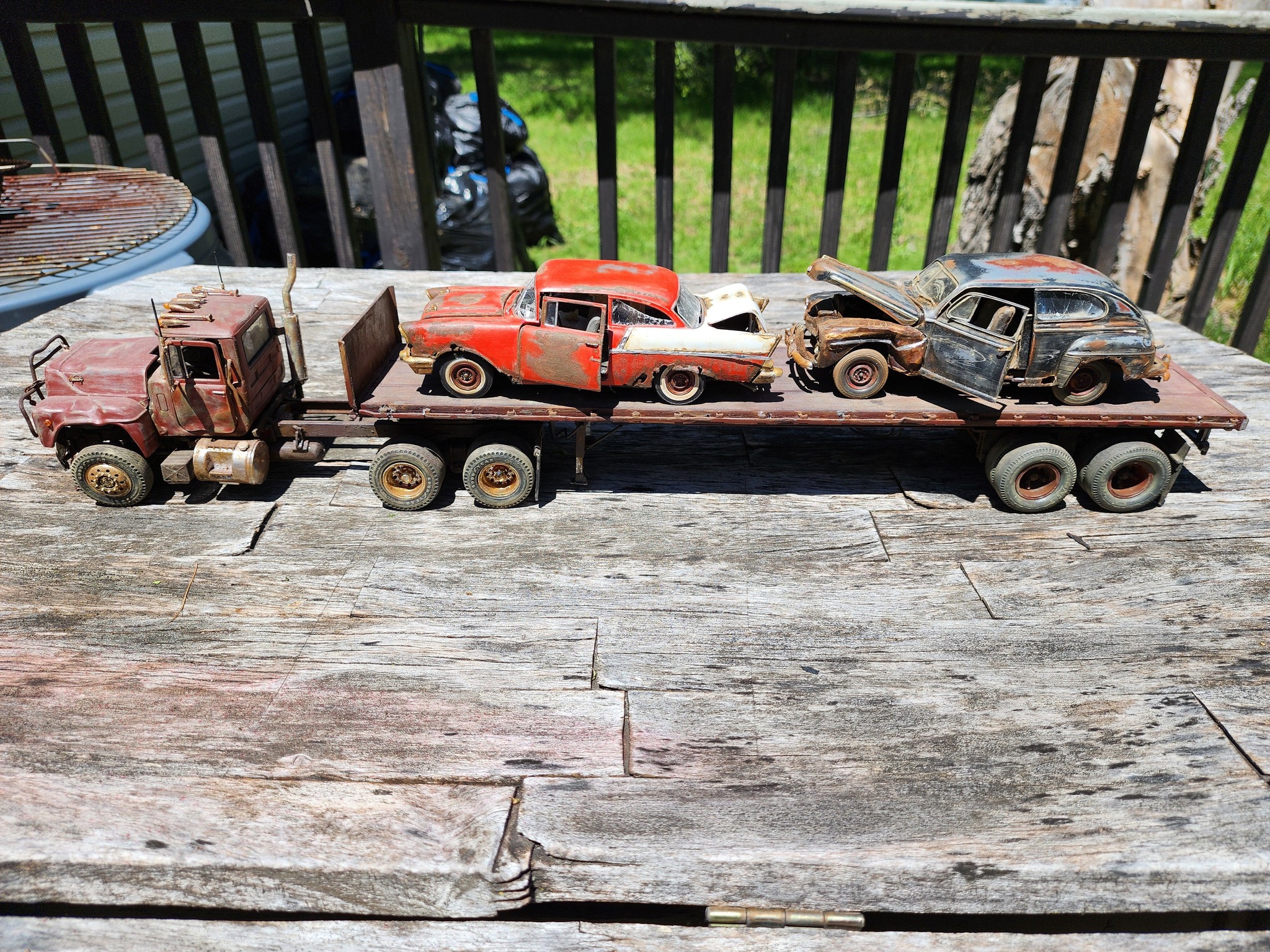 1967 Mack truck model with junk cars on flatbed trailer