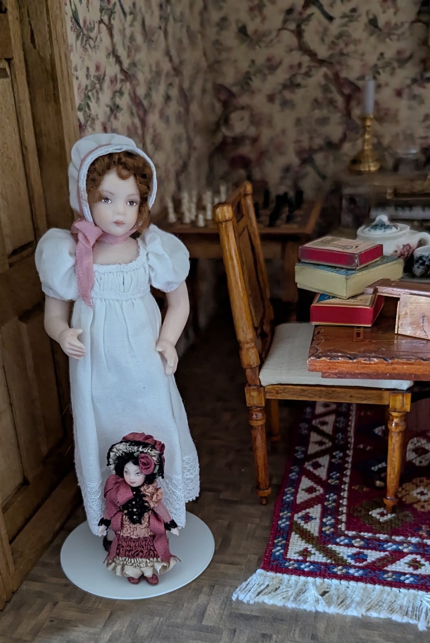 Terri's Dolls miniature porcelain doll in a dollhouse