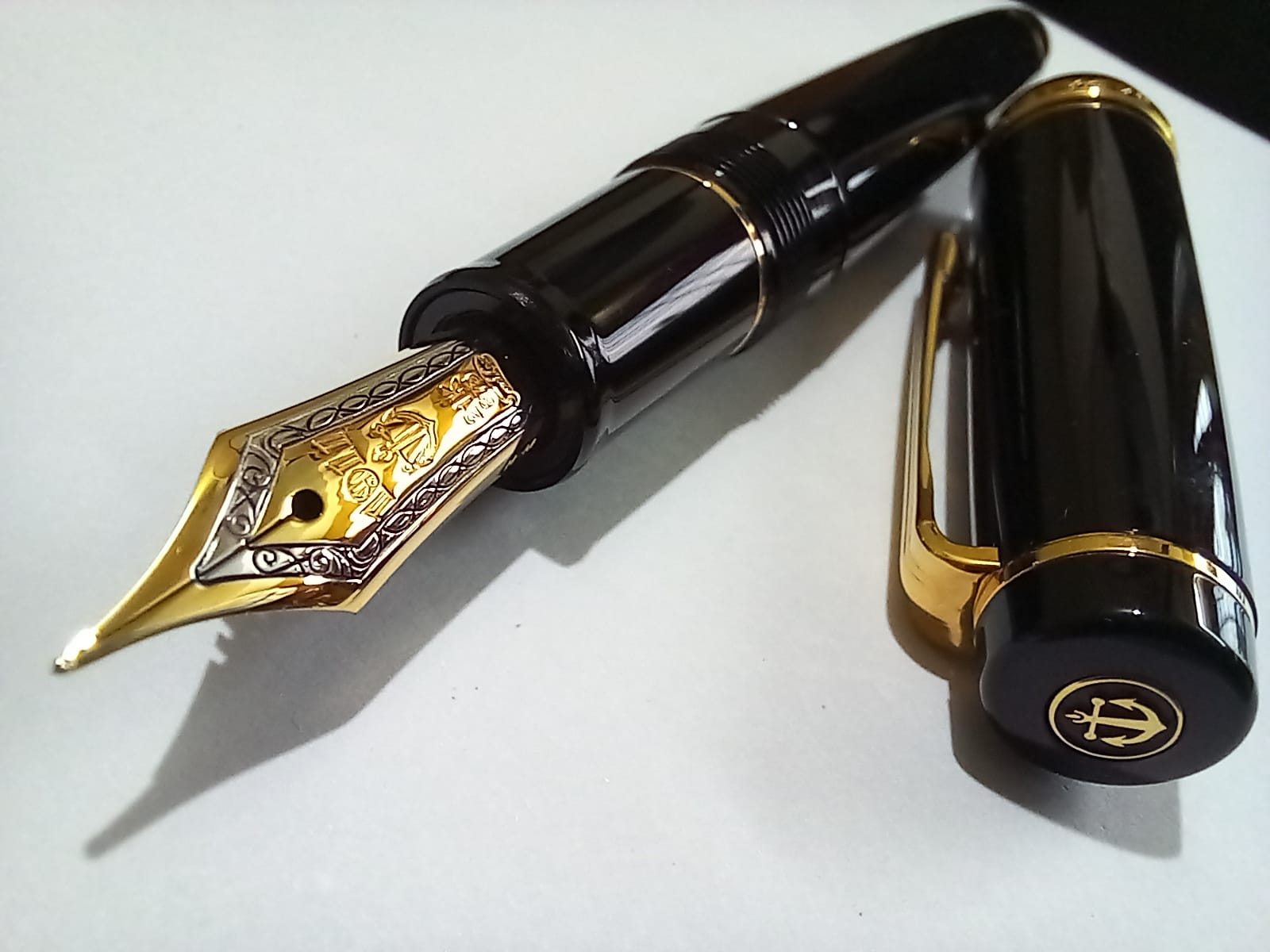 Sailor pens with 'gold from the Swiss bank' engraving