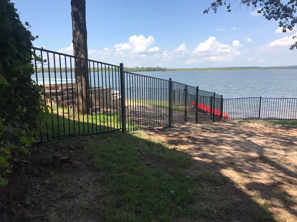 Dirt work and custom slope panels with... - Double K Fencing