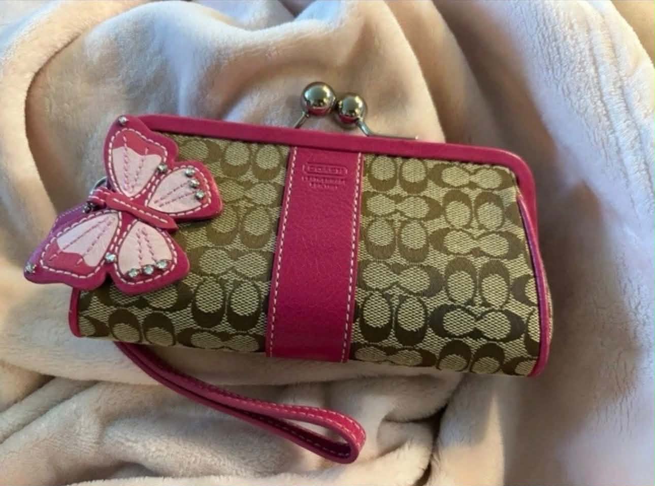 What is the value of a Coach Y2K brown signature C/Pink rhinestone 