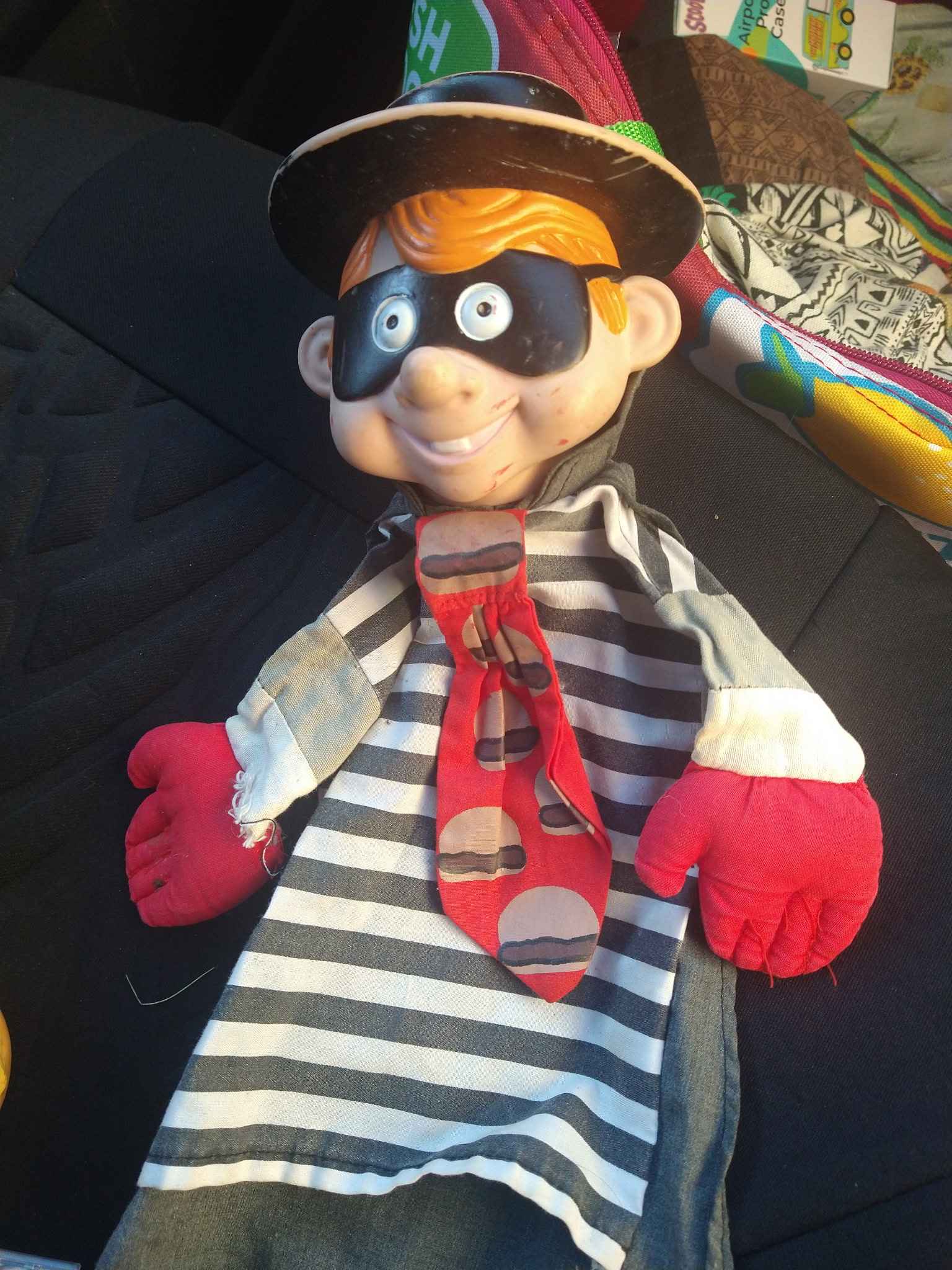 Vintage hand puppet has a plastic head and a fabric body. This 