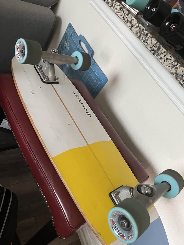 Riding Cloud Ride Iceez wheels on a short surfskate board