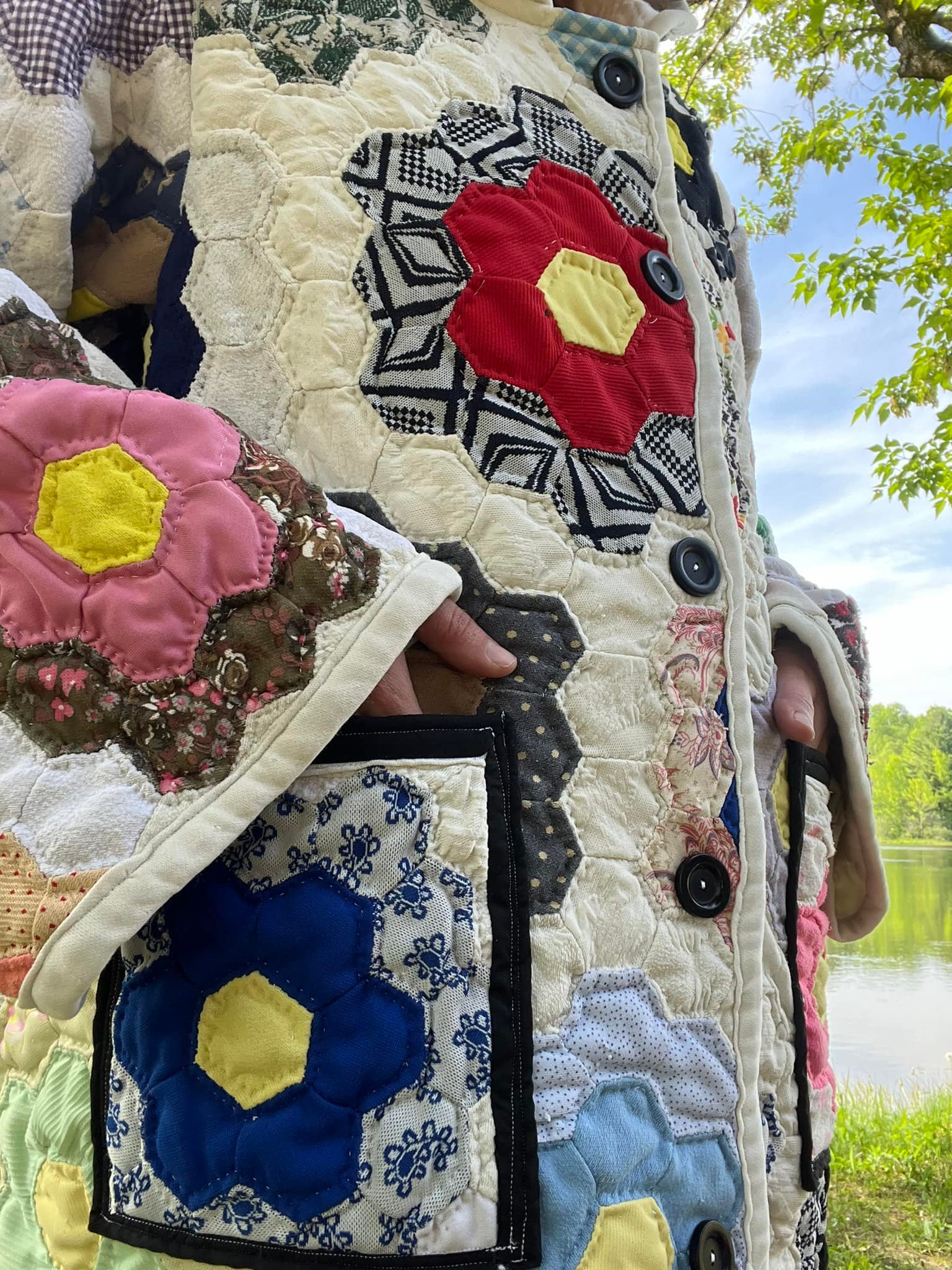Upcycled thrifted quilt into long coat with hood
