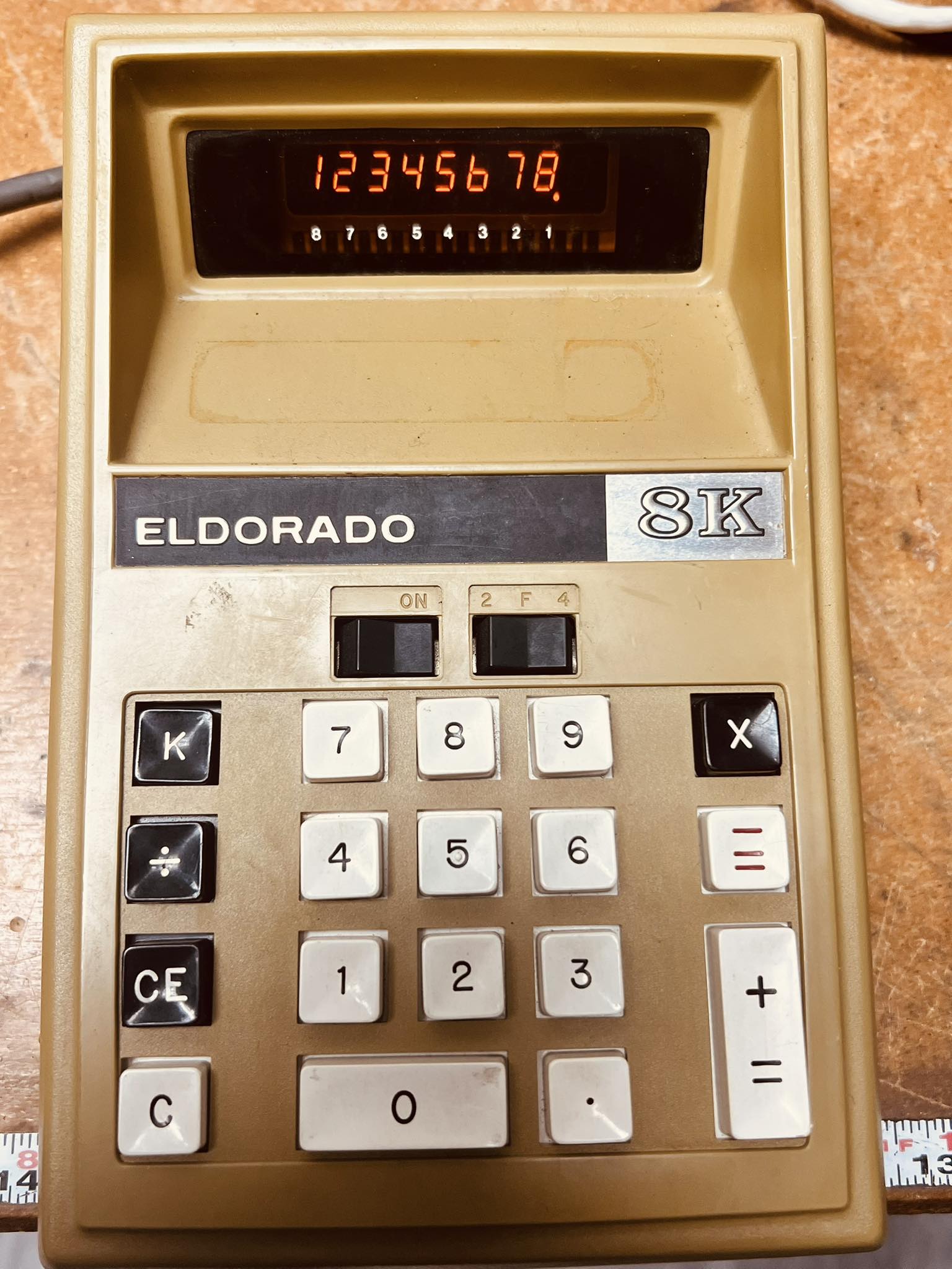 A 1971 neon display calculator. 123456 78 87654321 ELDORADO ON 8K