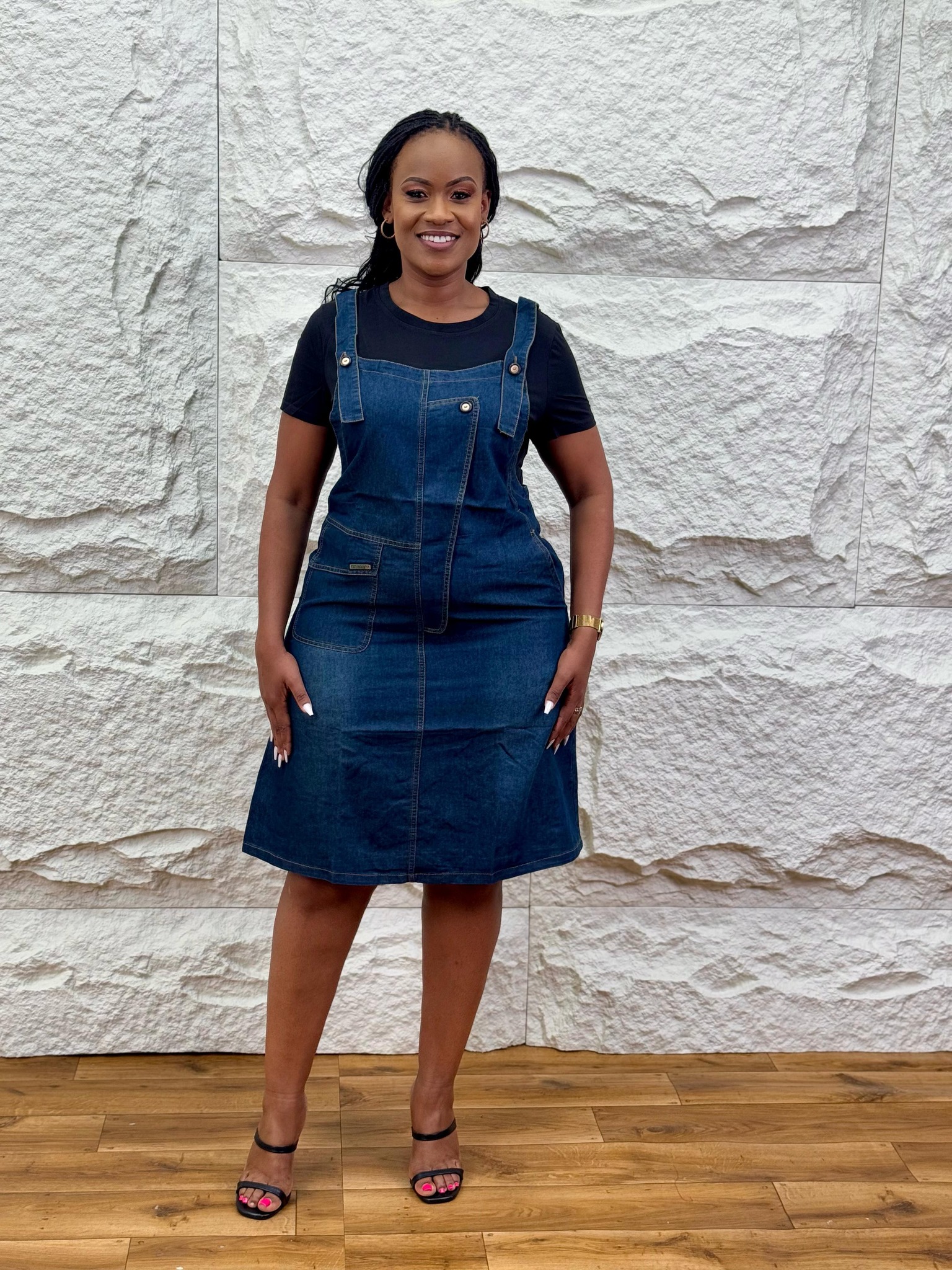 Black denim dungarees with buckle straps for sale