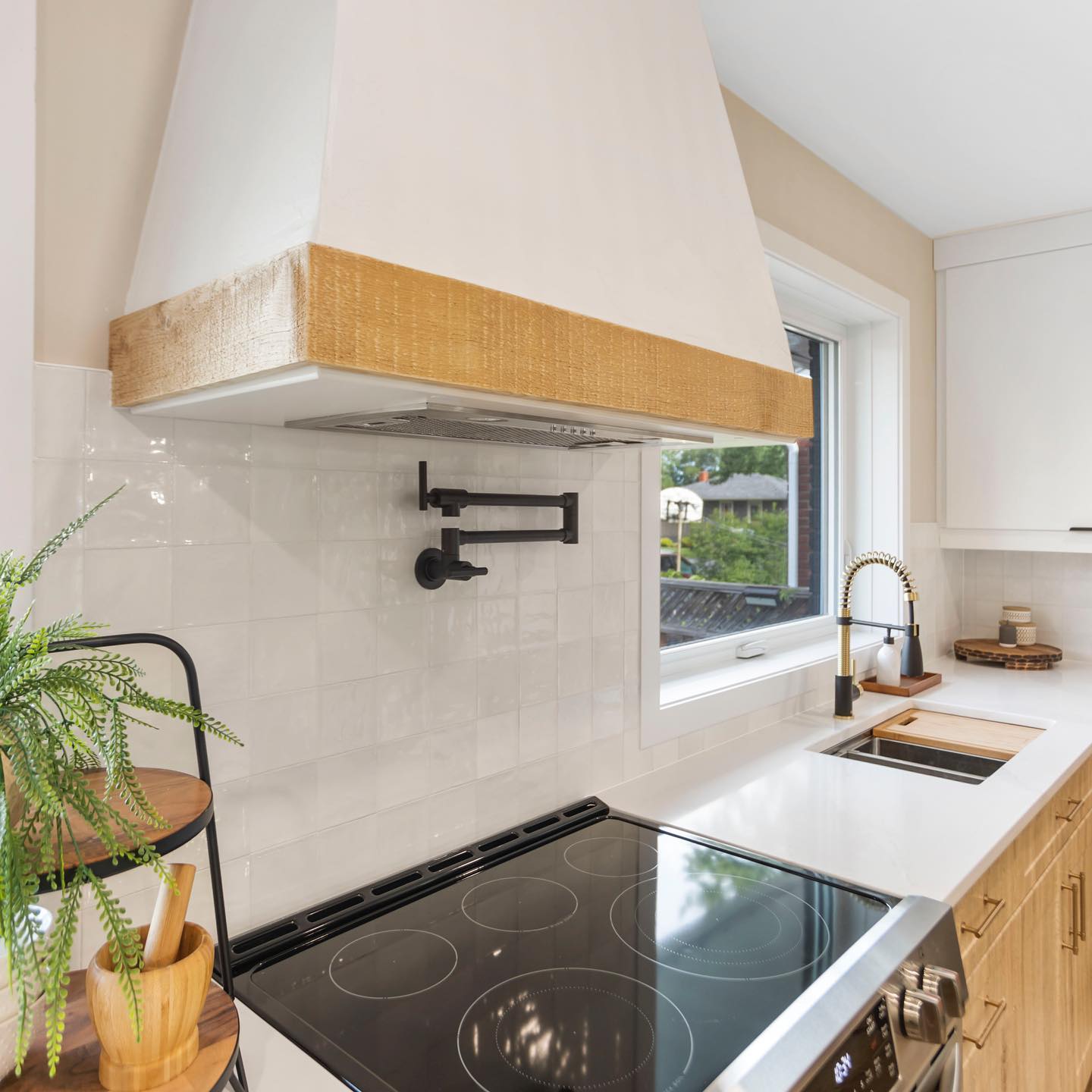 Black House Interiors - This custom plaster finish range hood is ...