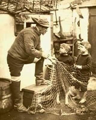 Passing on the skill, mending nets, Northumbria, northern England