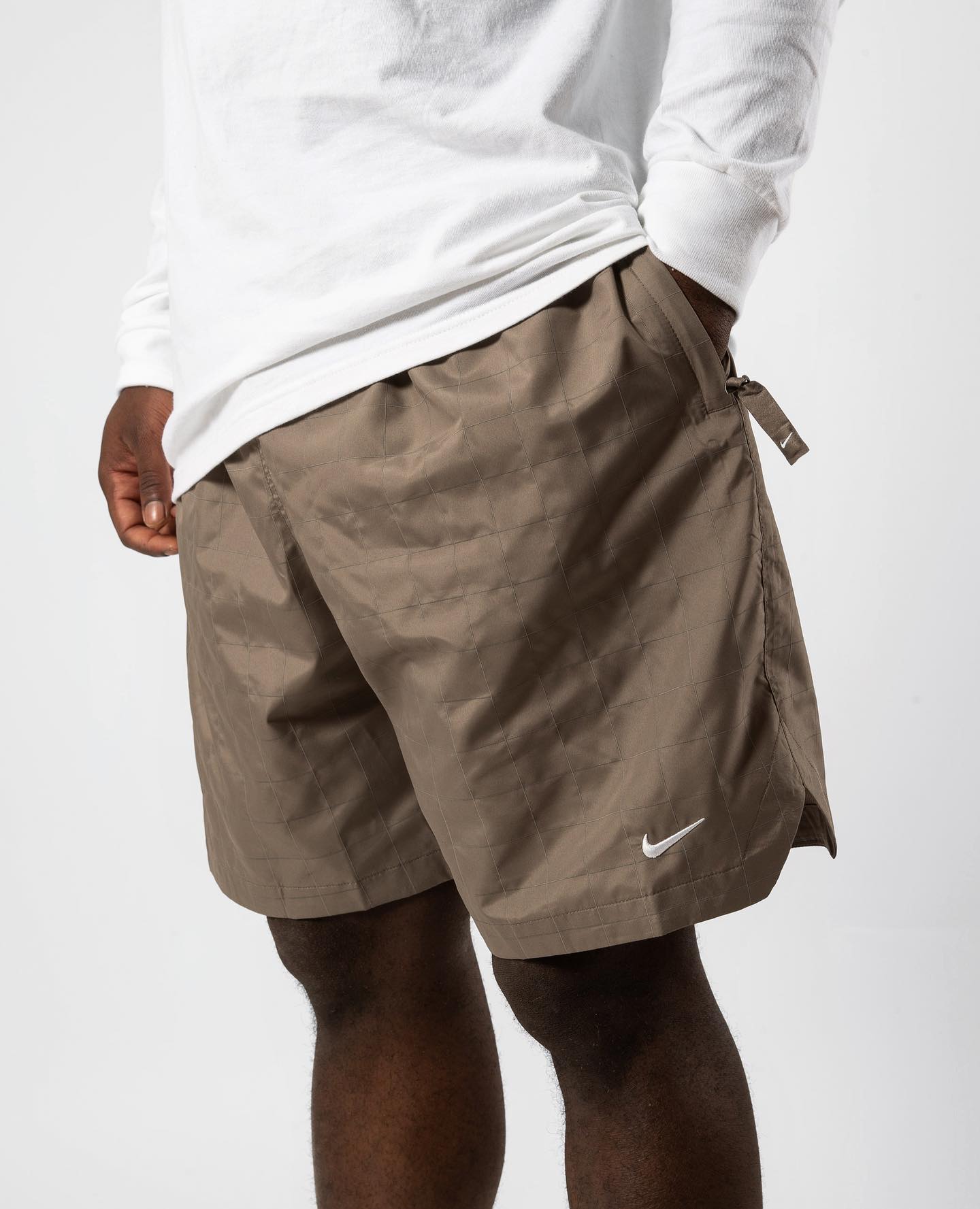 The NikeLab Flash Shorts feature an allover grid pattern that pops