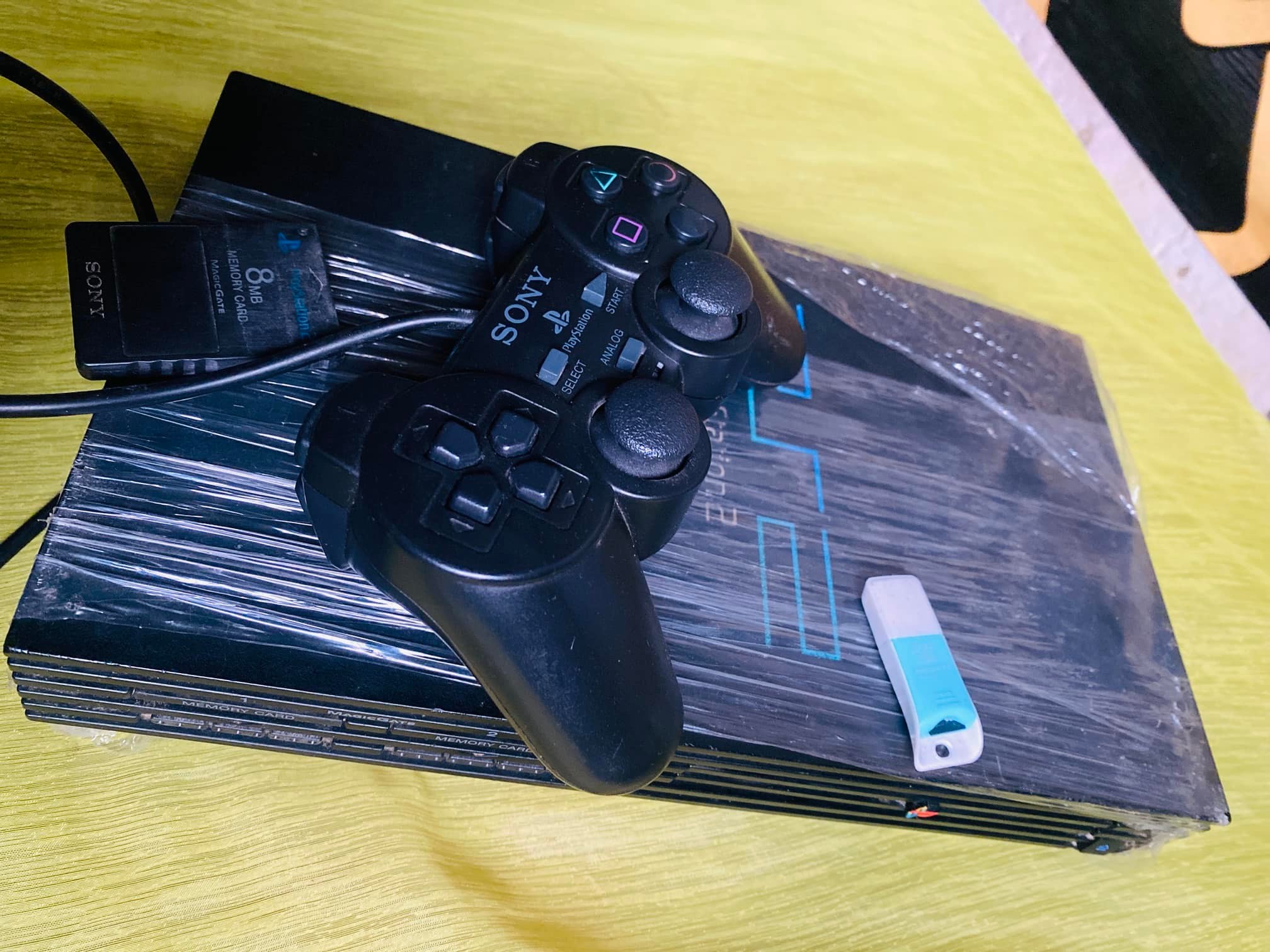 London used PlayStation 2 with memory card and 5 games for sale. Dm