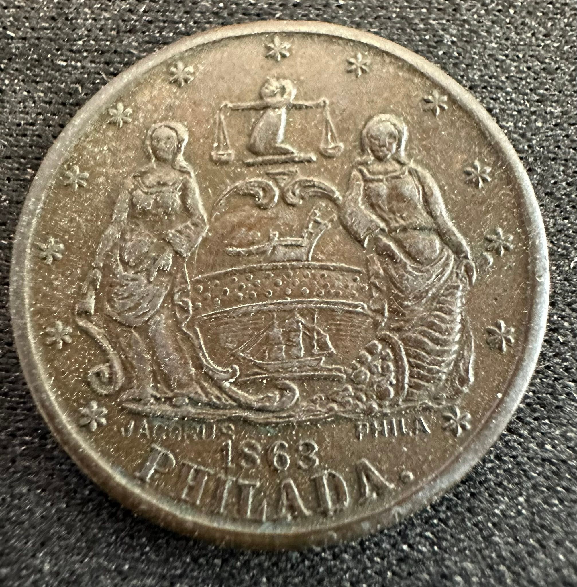 What is this 1863 civil war token with extra words?