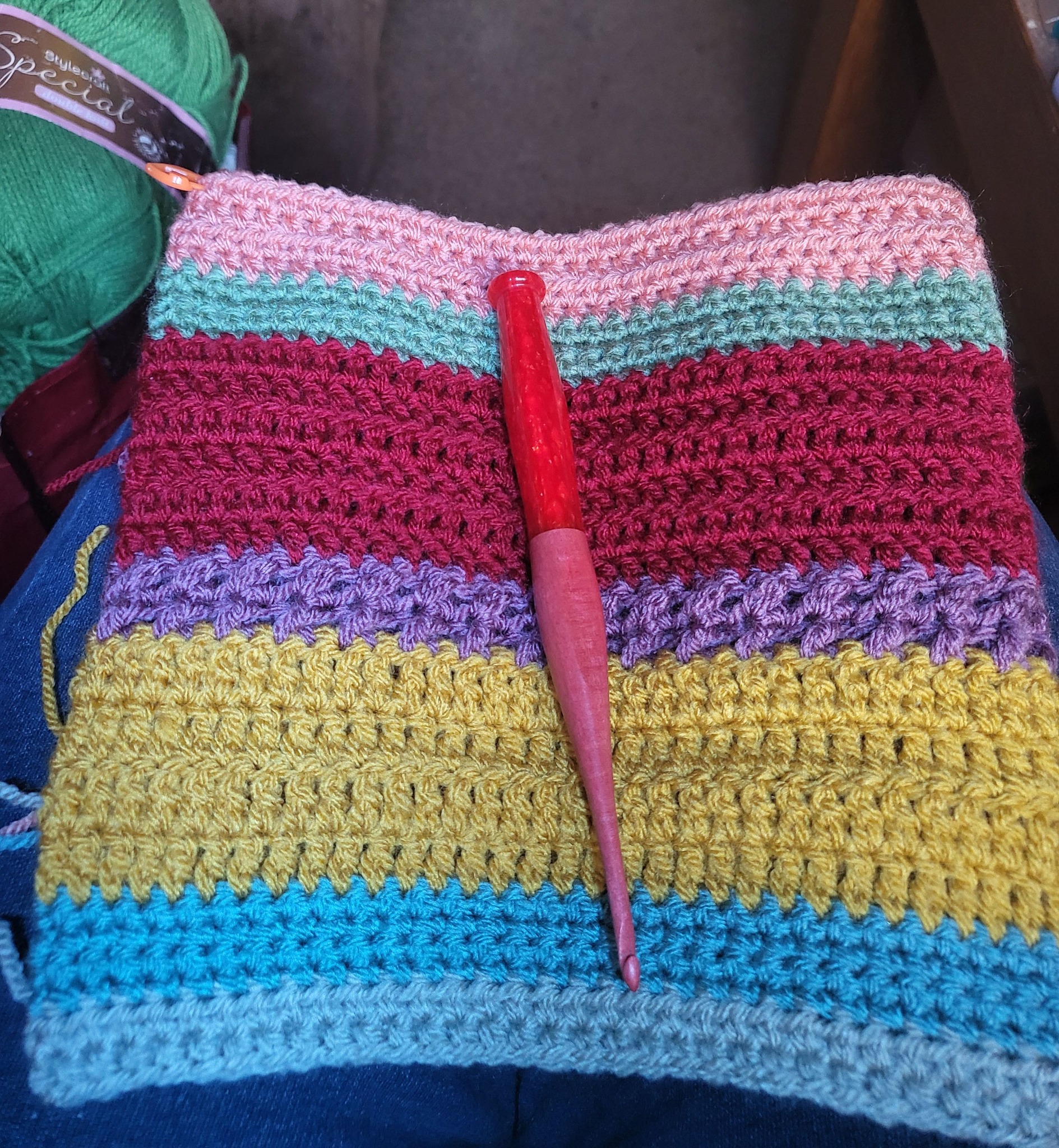 Chaos knitting sweater with random colors and improvised pattern