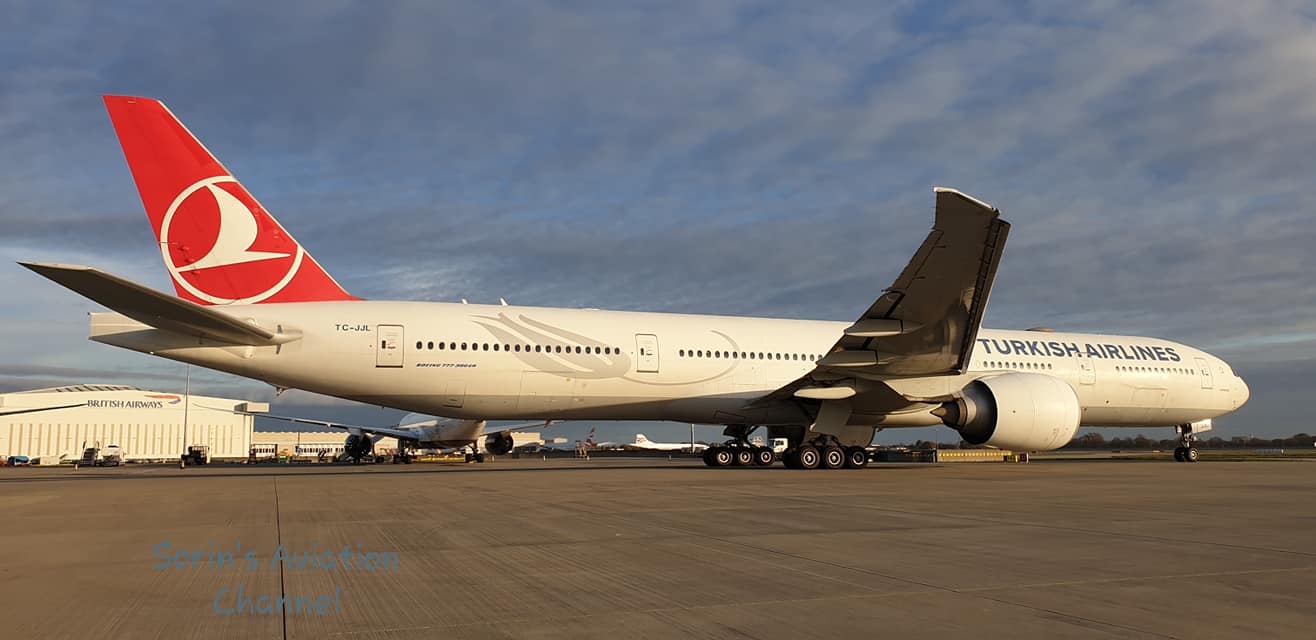 A Turkish Airlines Boeing 777-300ER climbs out of Runway 25R at