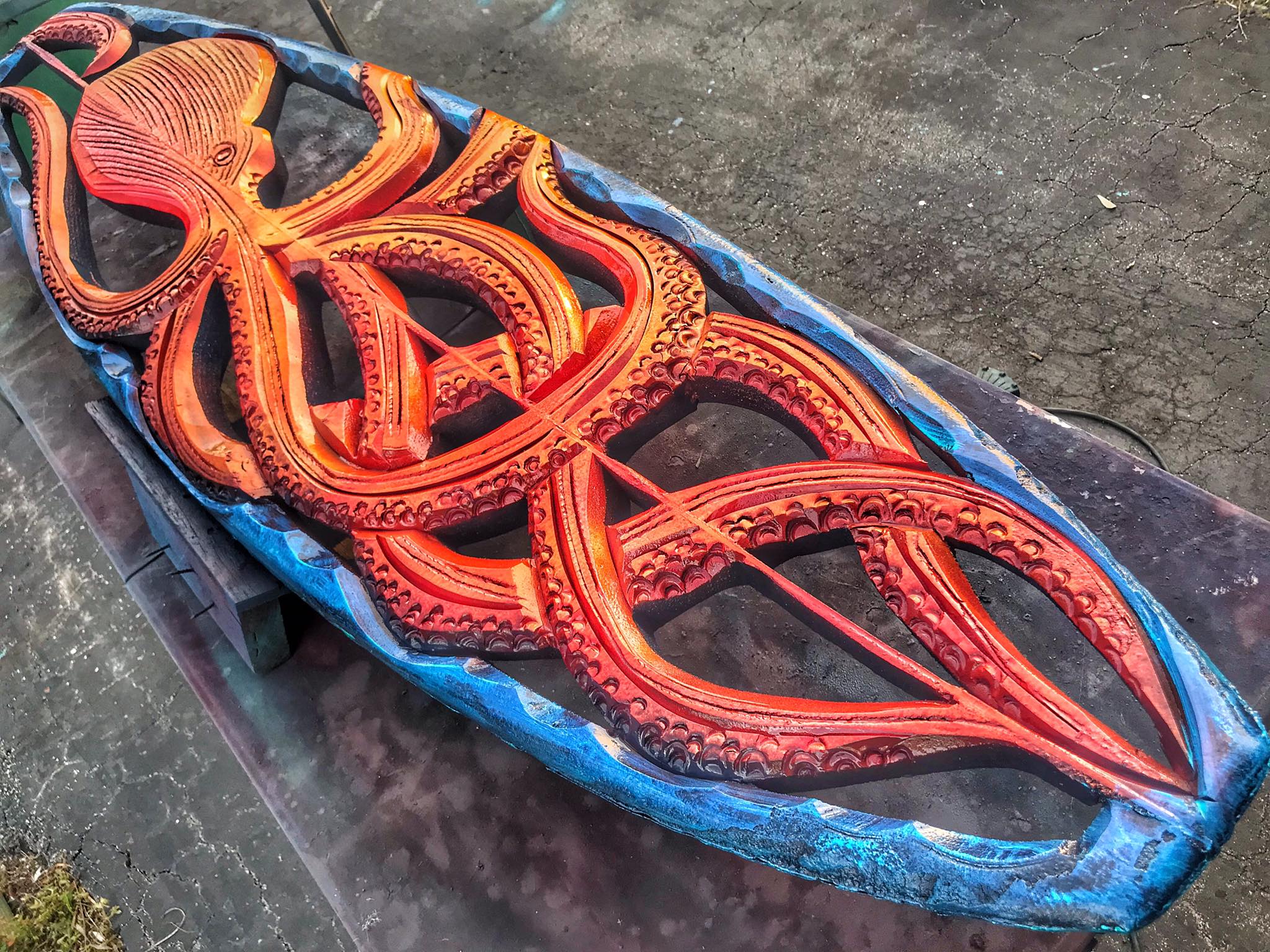 Custom octopus surfboard carvings by Jake Jones Gallery