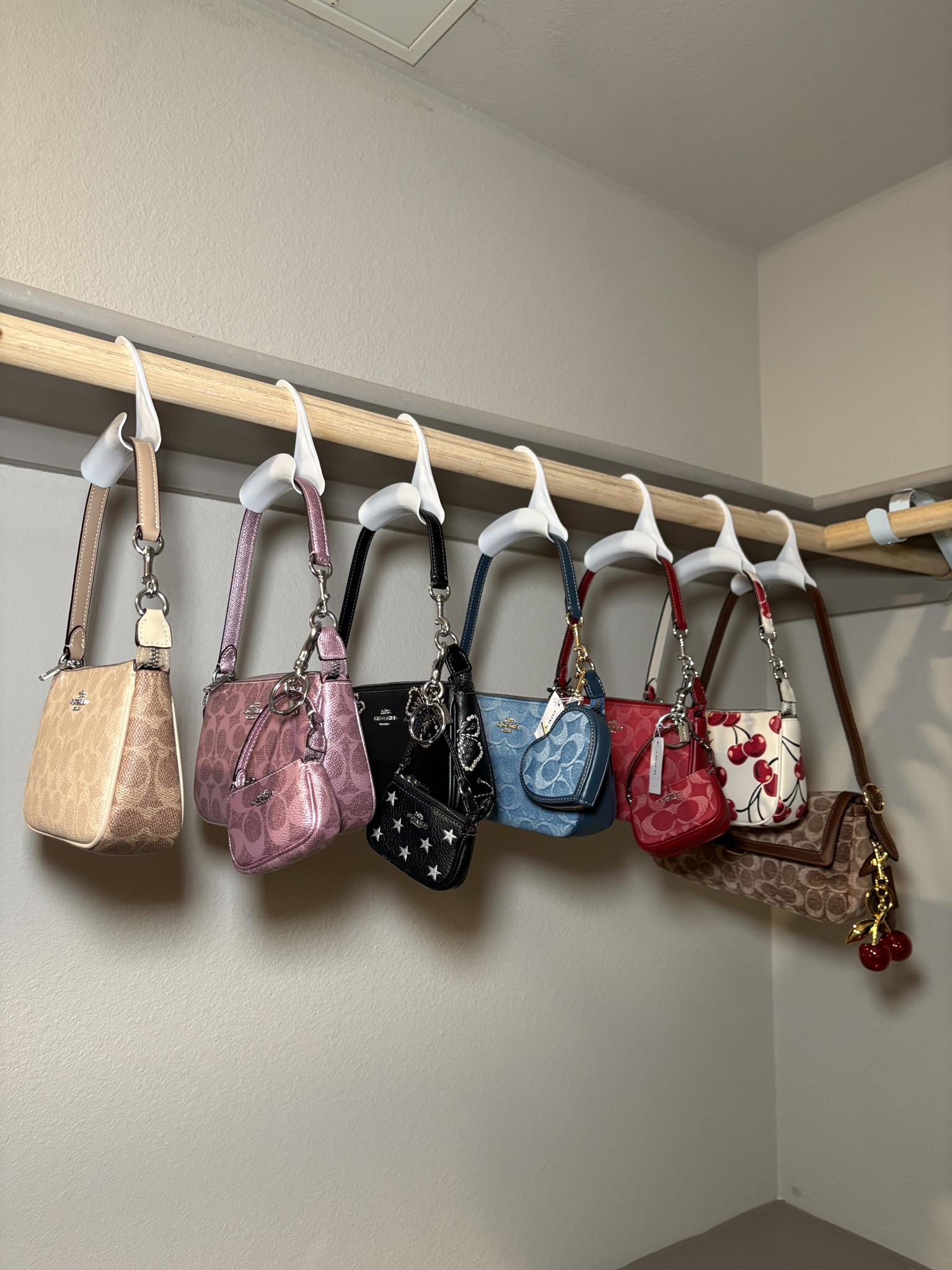 What are big Coach bags with charm accessories?