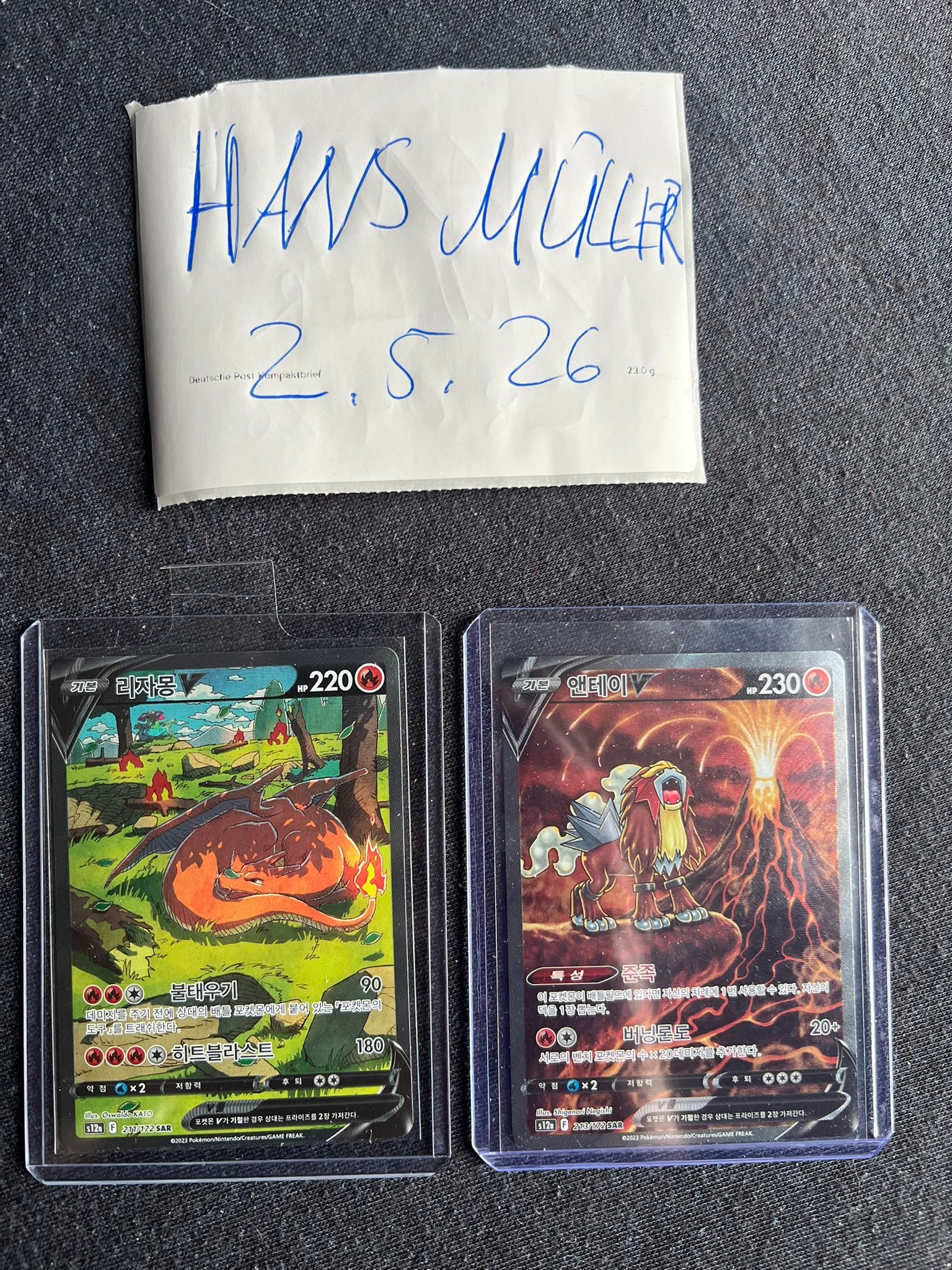 Charizard and Entei error cards with swapped foils