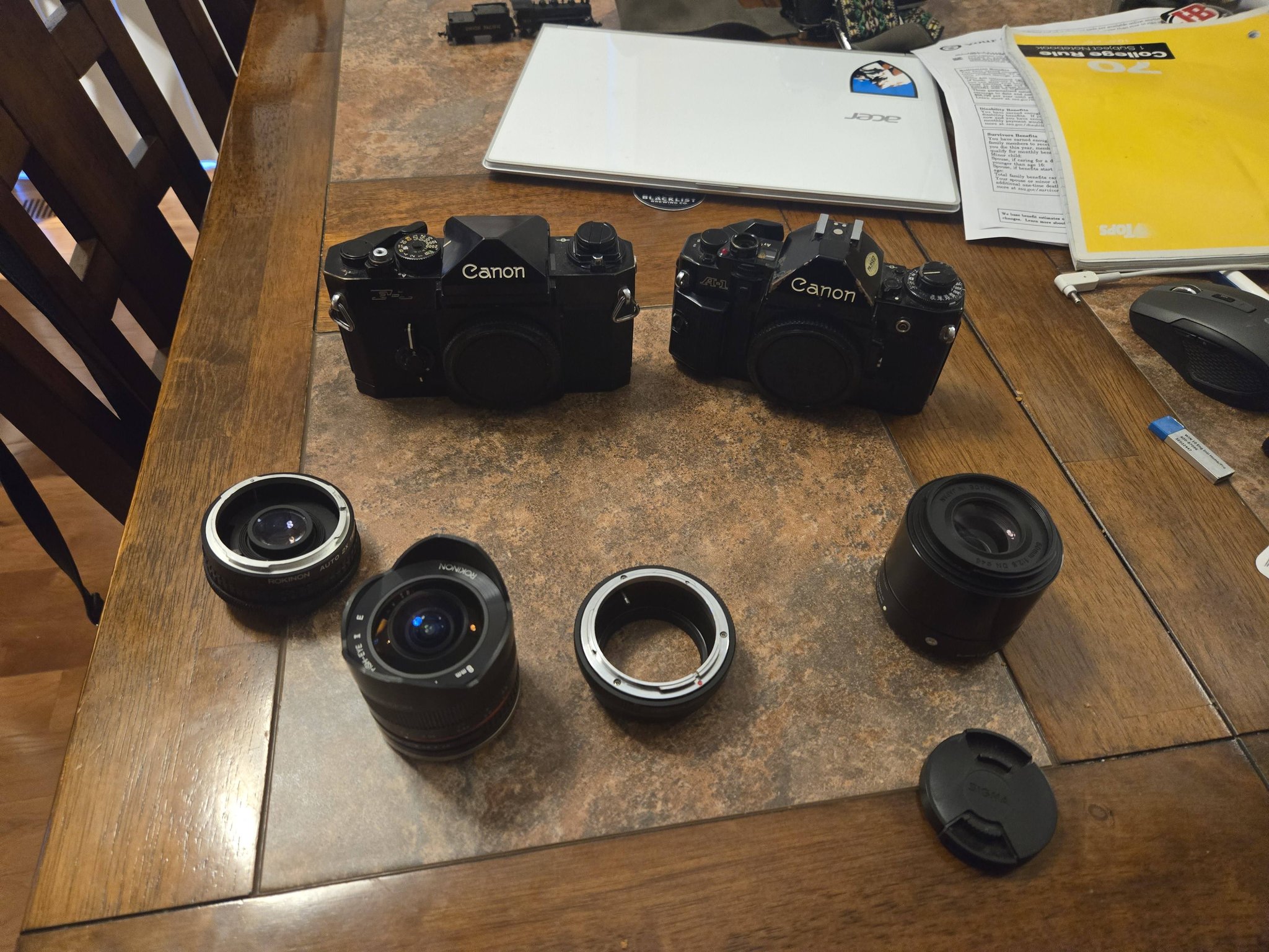 Canon F1 and A1 cameras with random lenses purchased for $80