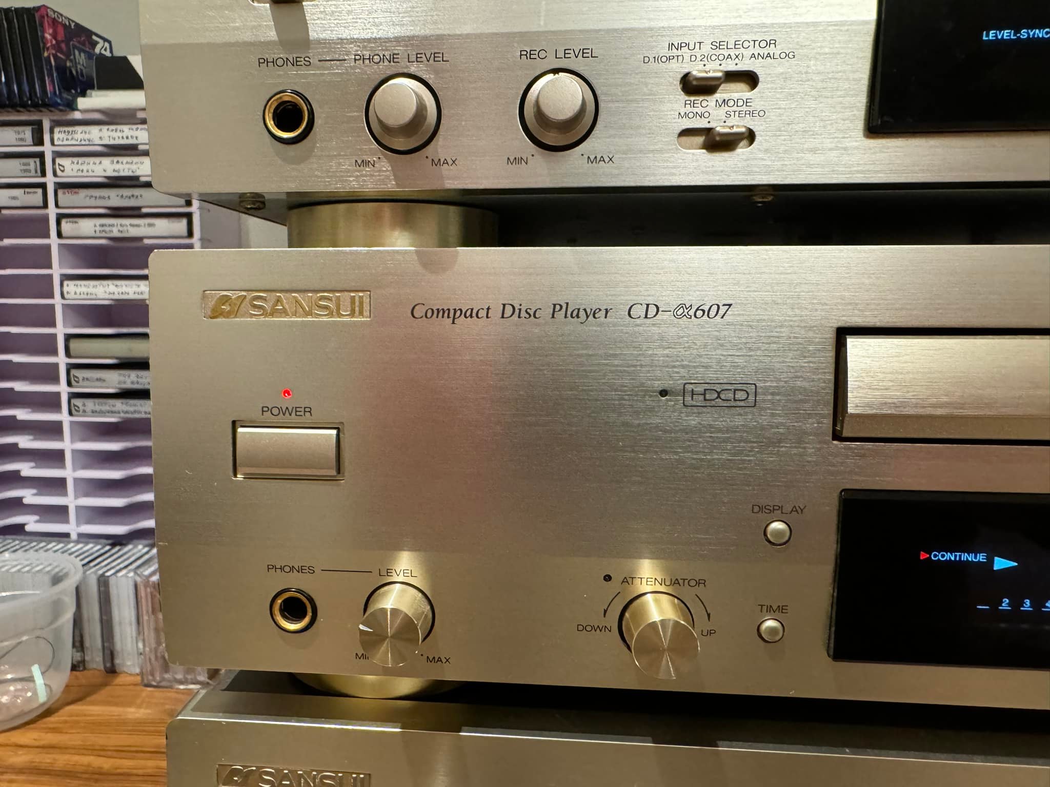 What's the difference between two Sansui Alpha 607 DR models?