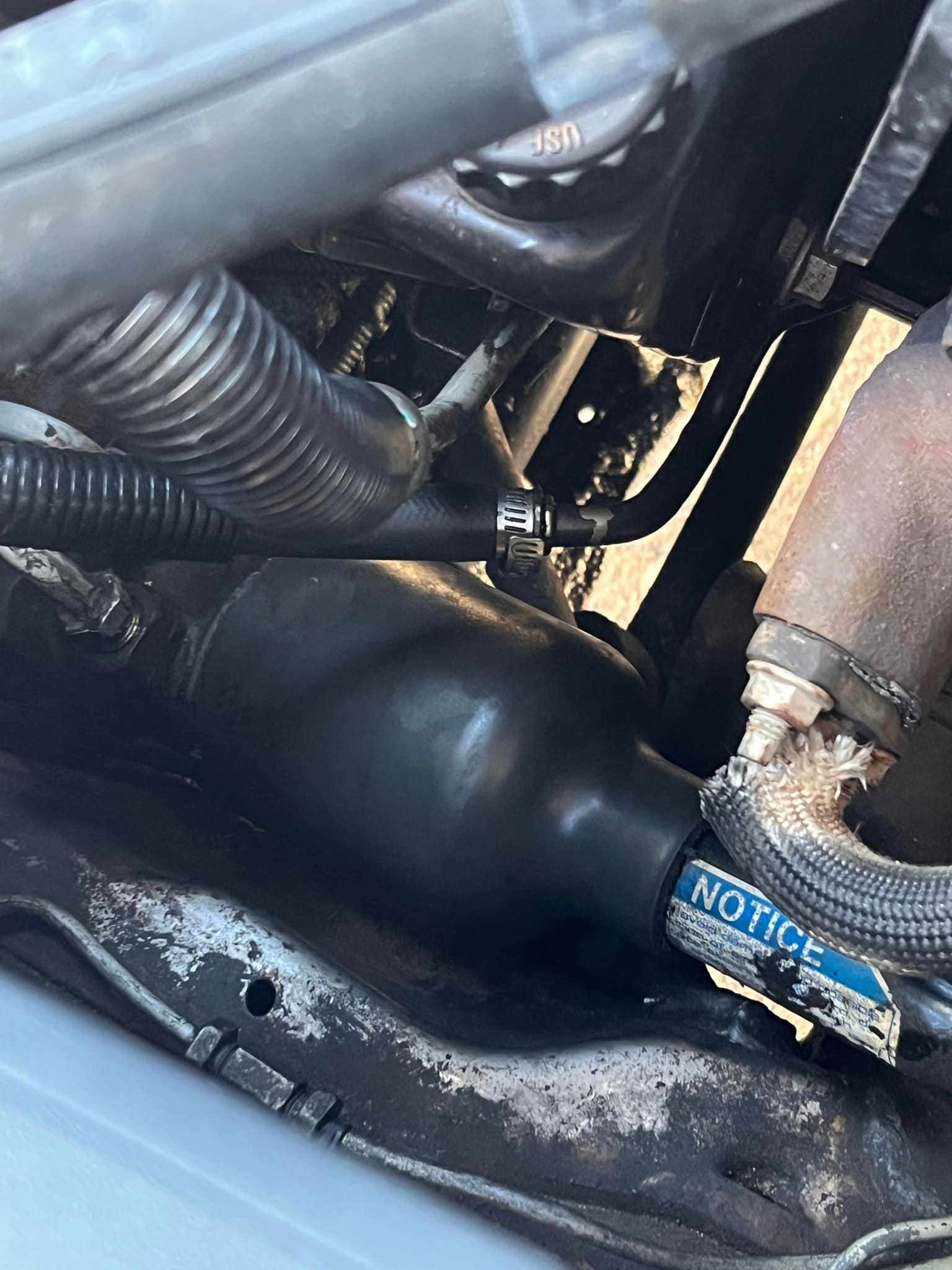 Any tricks to get the plastic cover to slide up the steering shaft?
