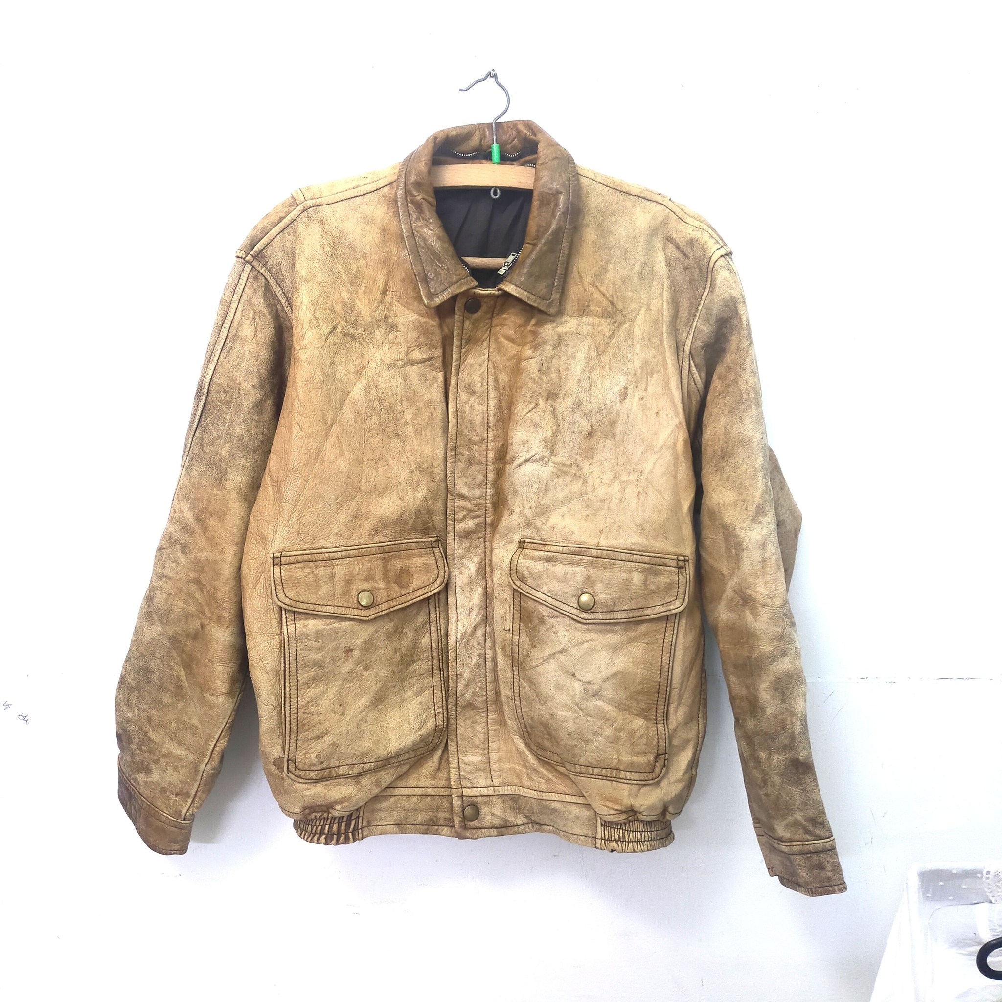Vintage leather flight jacket with patches and flag