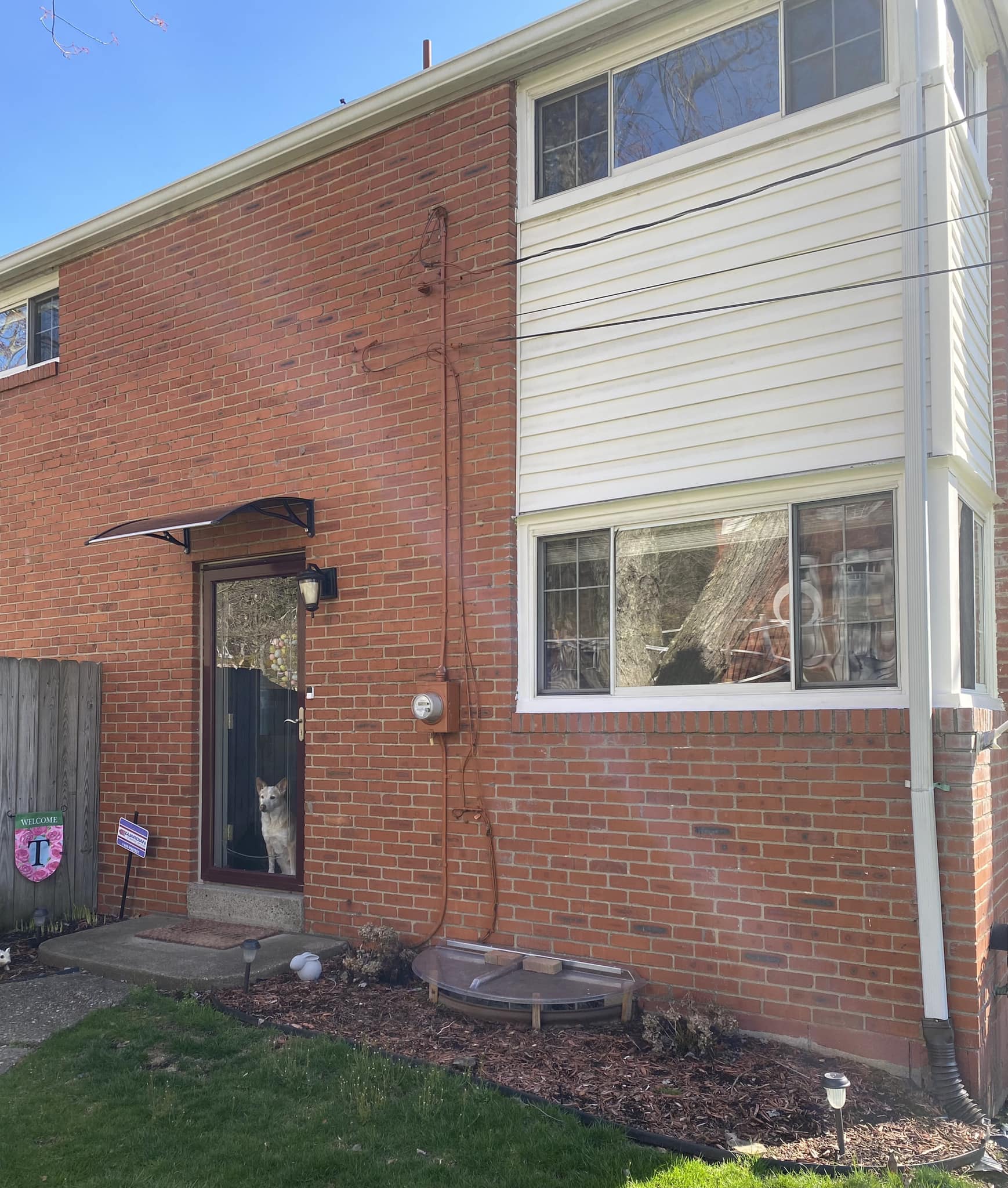 How to renovate a side entrance house with black siding and a