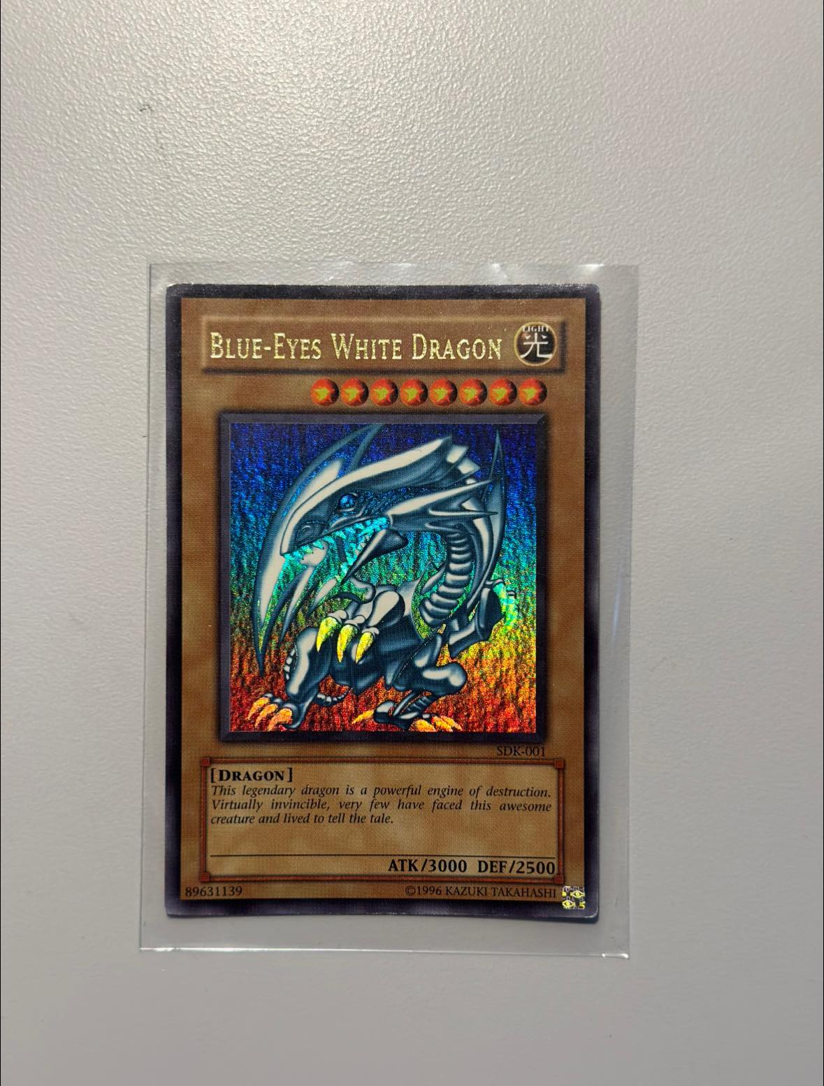 yugioh card sdk-001 Blue Eyes White Dragon 2002 (Kazuki, Yu Gi Oh) ** PSA Graded 8 ** Your opponent gains 1000 Life Points at each of his/her Standby Phases. Is this card real? (I