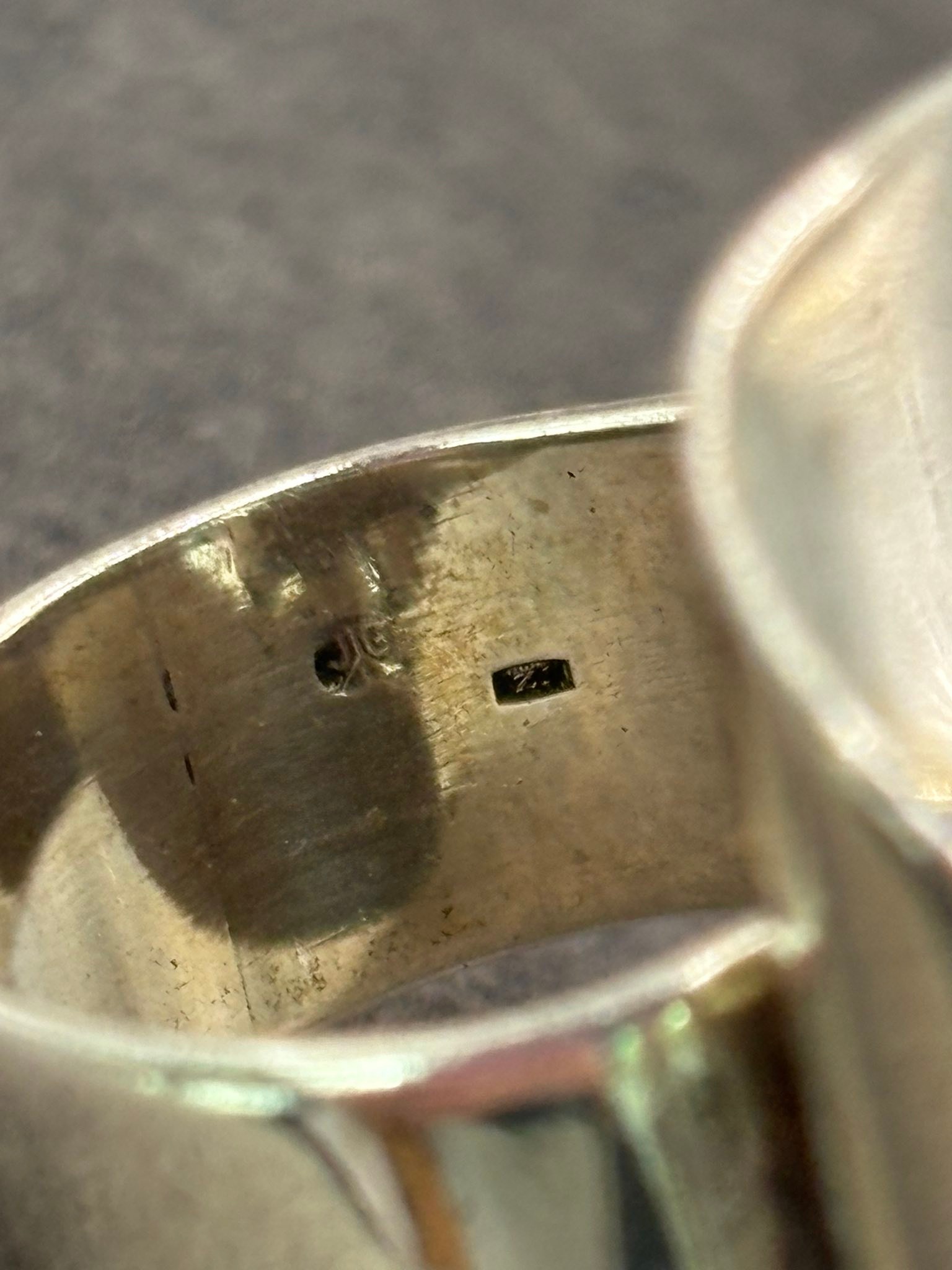 What are the initials JG on a silver ring without markings?